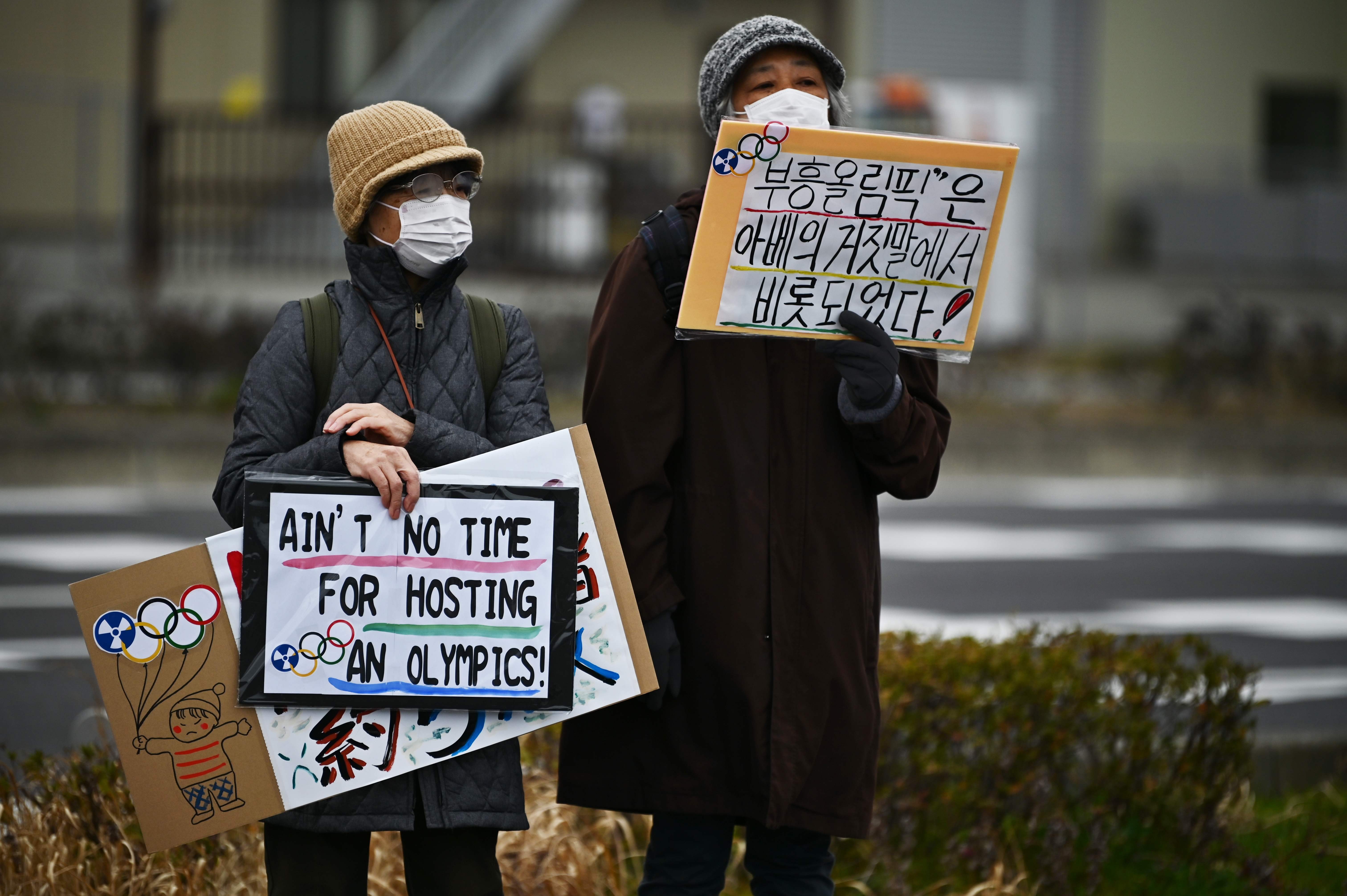 Protesters at a demonstration against the Tokyo Olympics, Prime Minister Shinzo Abe and nuclear energy on February 29, near the J-Village stadium that will host the start of the Olympic torch relay in Naraha, Fukushima prefecture. Photo: AFP