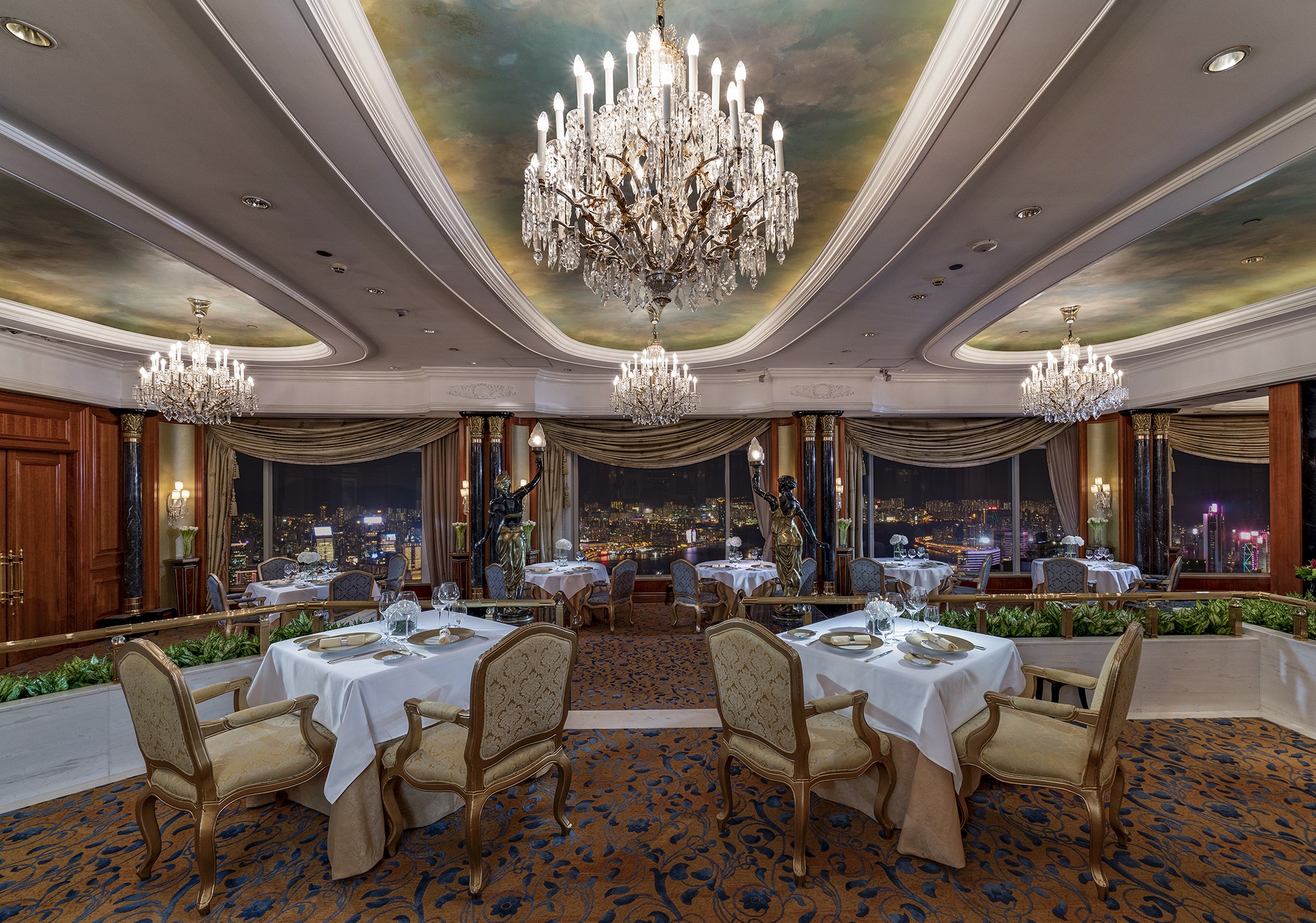 Chandeliers, marble columns and ornate cornices at Restaurant Petrus. Photos; handouts