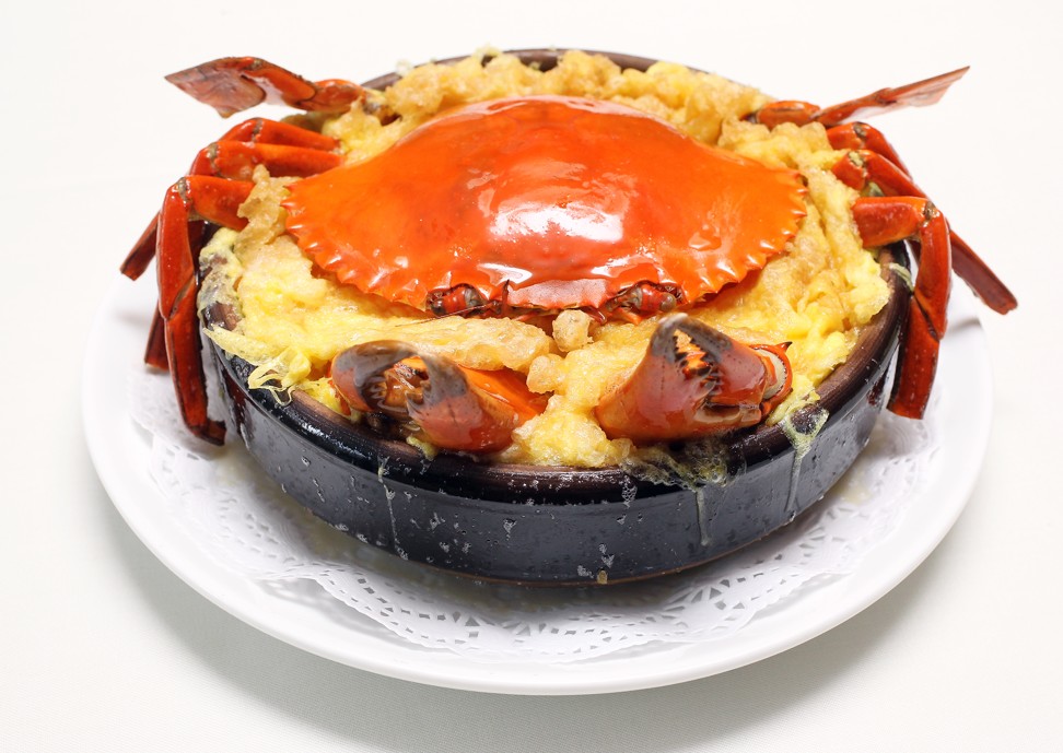 Baked crab in clay pot.