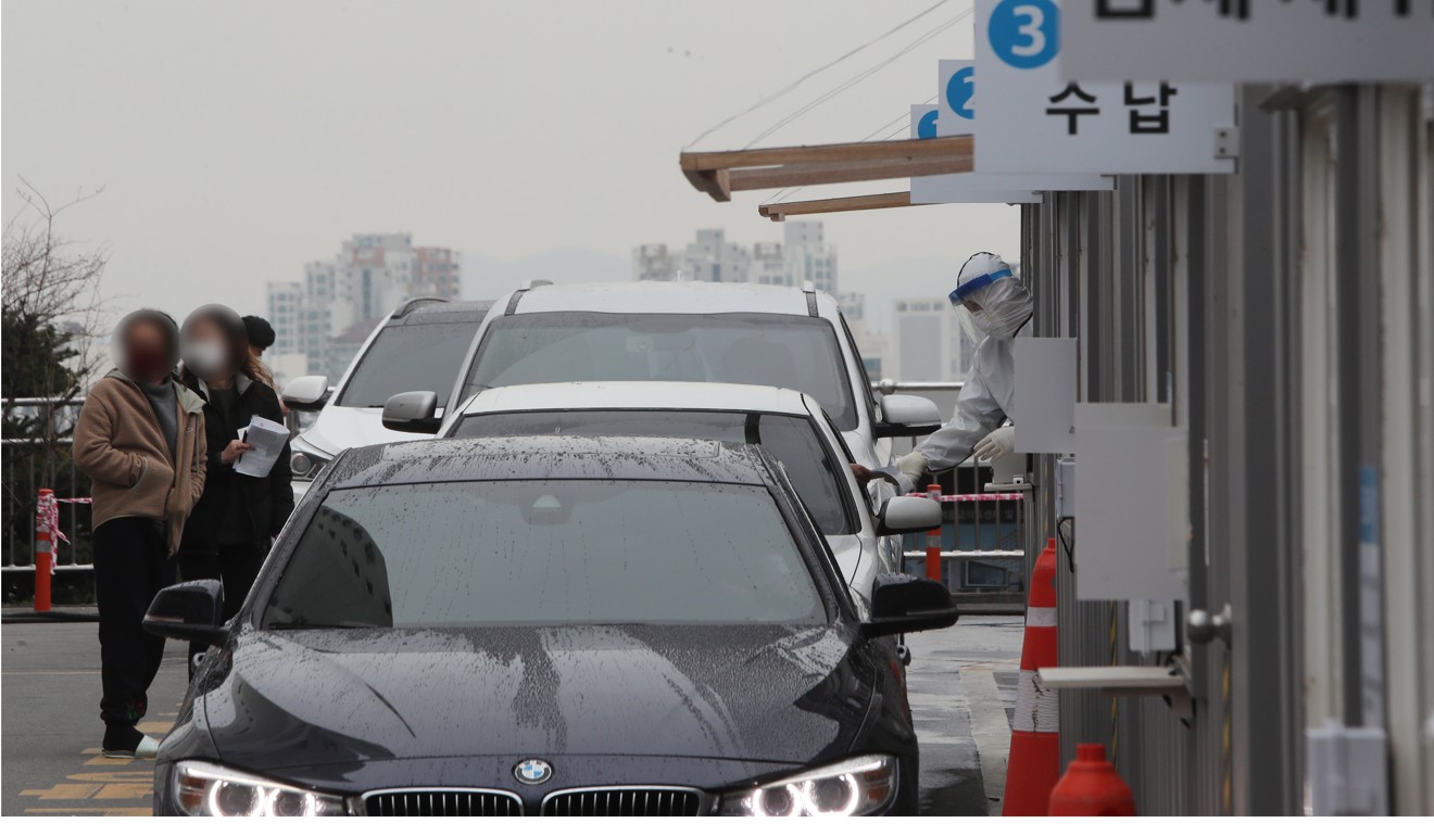 Cars wait in line at a drive-through Covid-19 testing centre at Yeungnam University Medical Centre in Daegu, South Korea. Photo: EPA-EFE