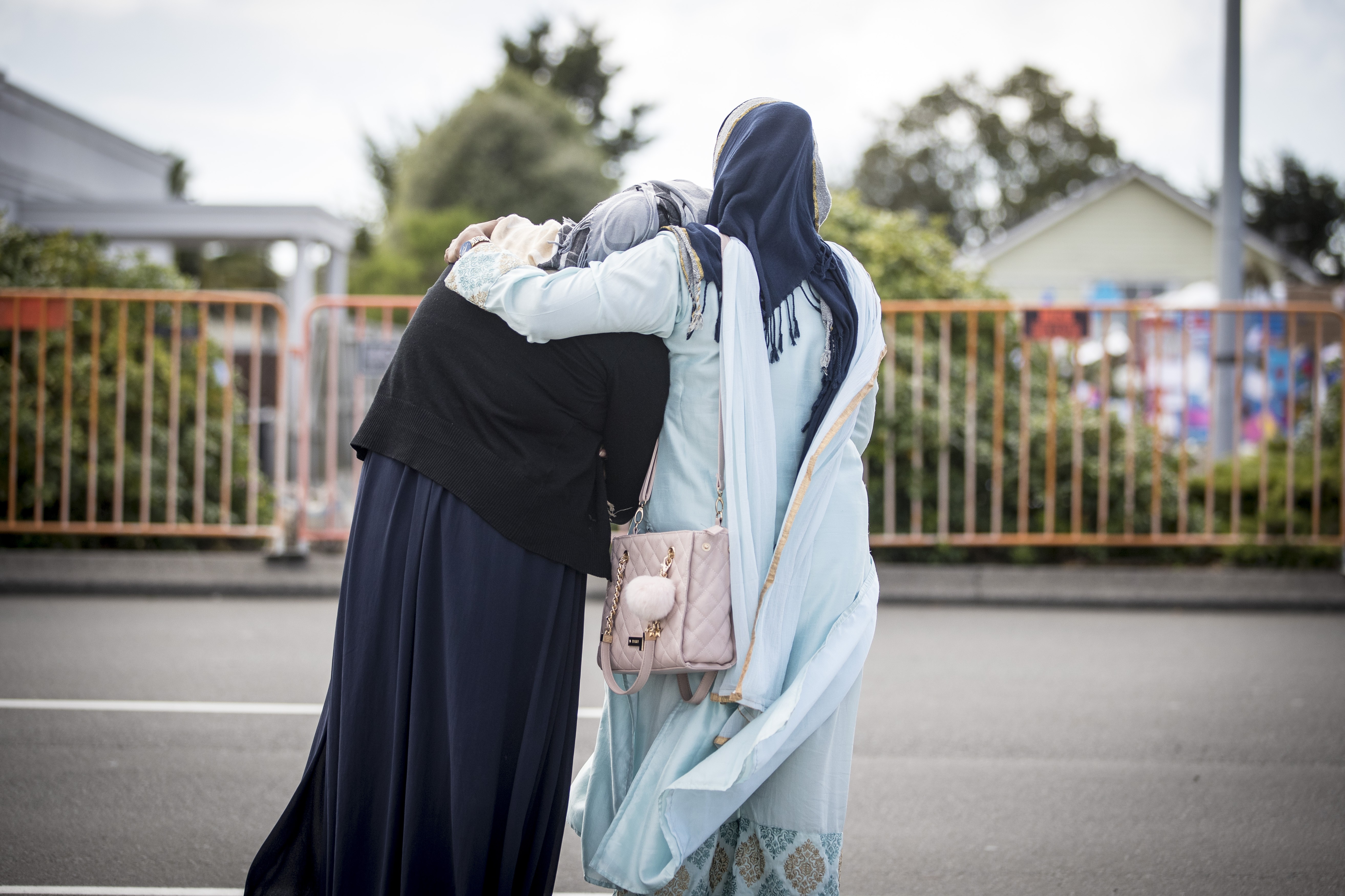 Two residents comfort each other in New Zealand on March 22, 2019. File photo: NZ Herald