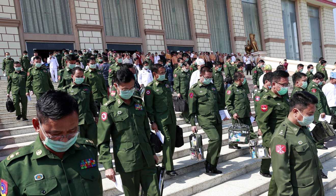 Military representatives leave after a regular session of the Union Parliament. Photo: AP