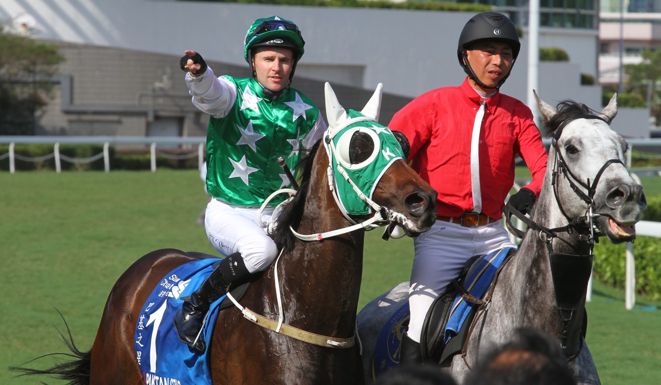 Tommy Berry celebrates winning the 2018 Group One Champions & Chater Cup with Pakistan Star.