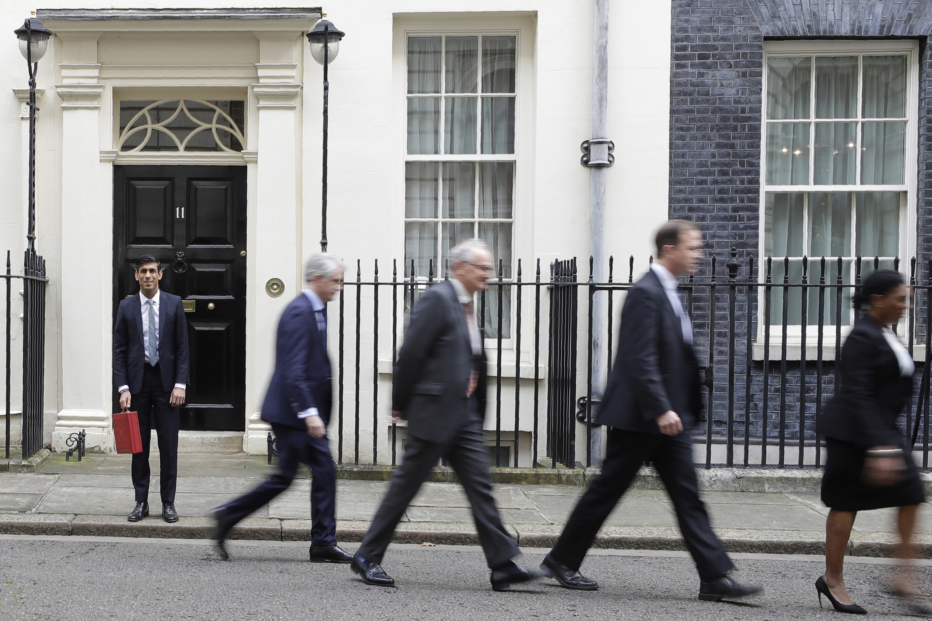 Britain’s Chancellor of the Exchequer Rishi Sunak (left) and his ministerial team prepare to leave No 11 Downing Street for the House of Commons, where he will unveil Britain’s first budget since it left the EU. Photo: AP