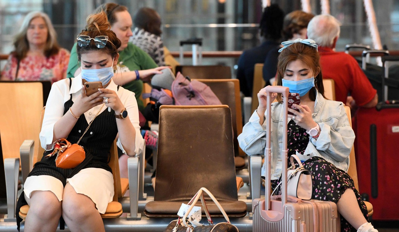 Travellers at the departure hall of Changi International Airport in Singapore. Photo: AFP