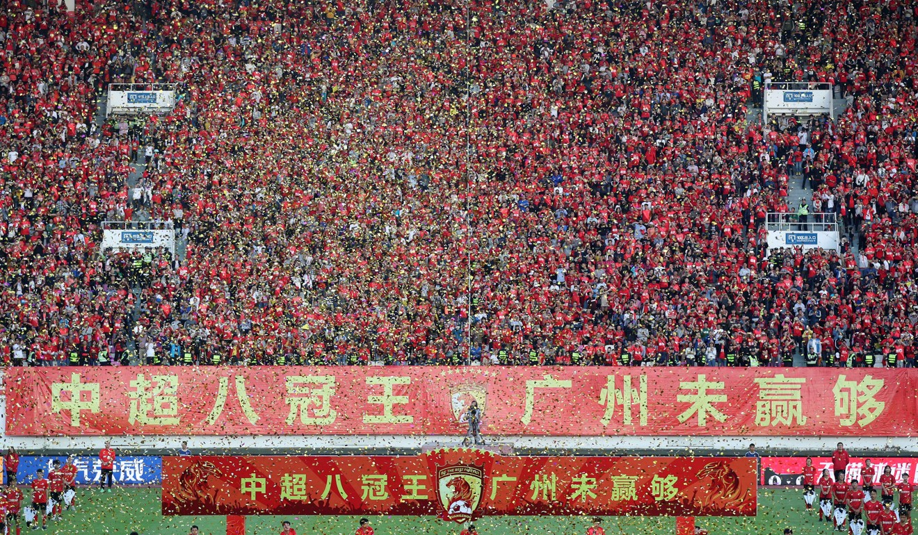 Fans celebrate as Guangzhou Evergrande lift their eighth league championship in 2019. Photo: Xinhua