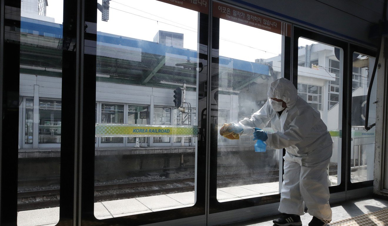 A worker disinfects a Seoul subway station as a precaution against the new coronavirus. Photo: AP