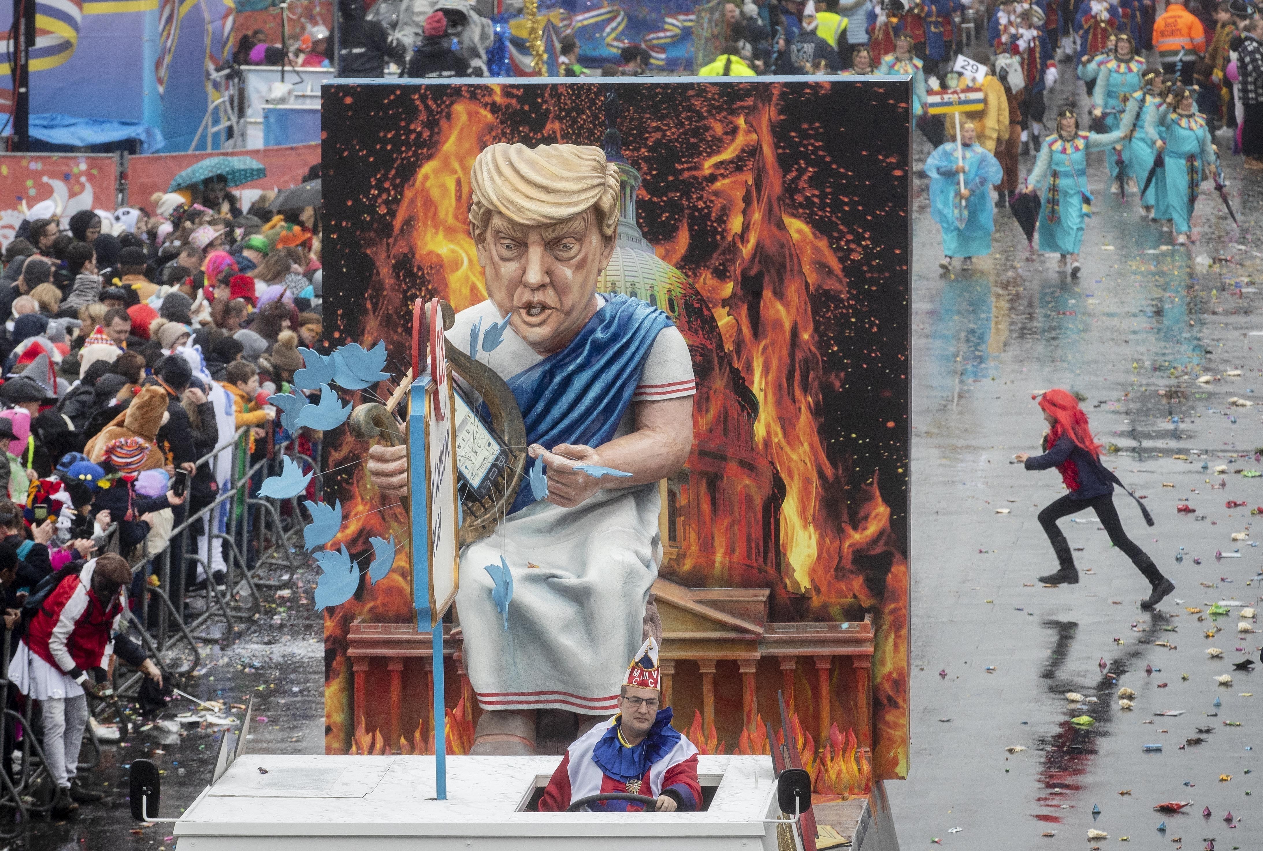 A figure depicting US President Donald Trump as Emperor Nero “fiddling while Rome burns” is displayed in a traditional carnival parade in Mainz, Germany. Photo: AP