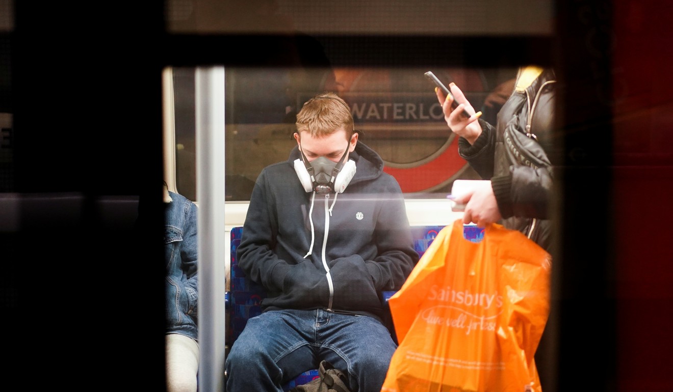 A person wearing a protective face mask on the London Underground. Photo: Reuters