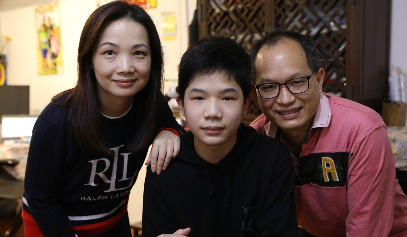 Student Alex Leung (centre) with his parents Julie Louie and Santa Leung. Alex says it is particularly difficult to catch up with science lessons online, as lab sessions cannot be properly recreated at home. Photo: K.Y. Cheng
