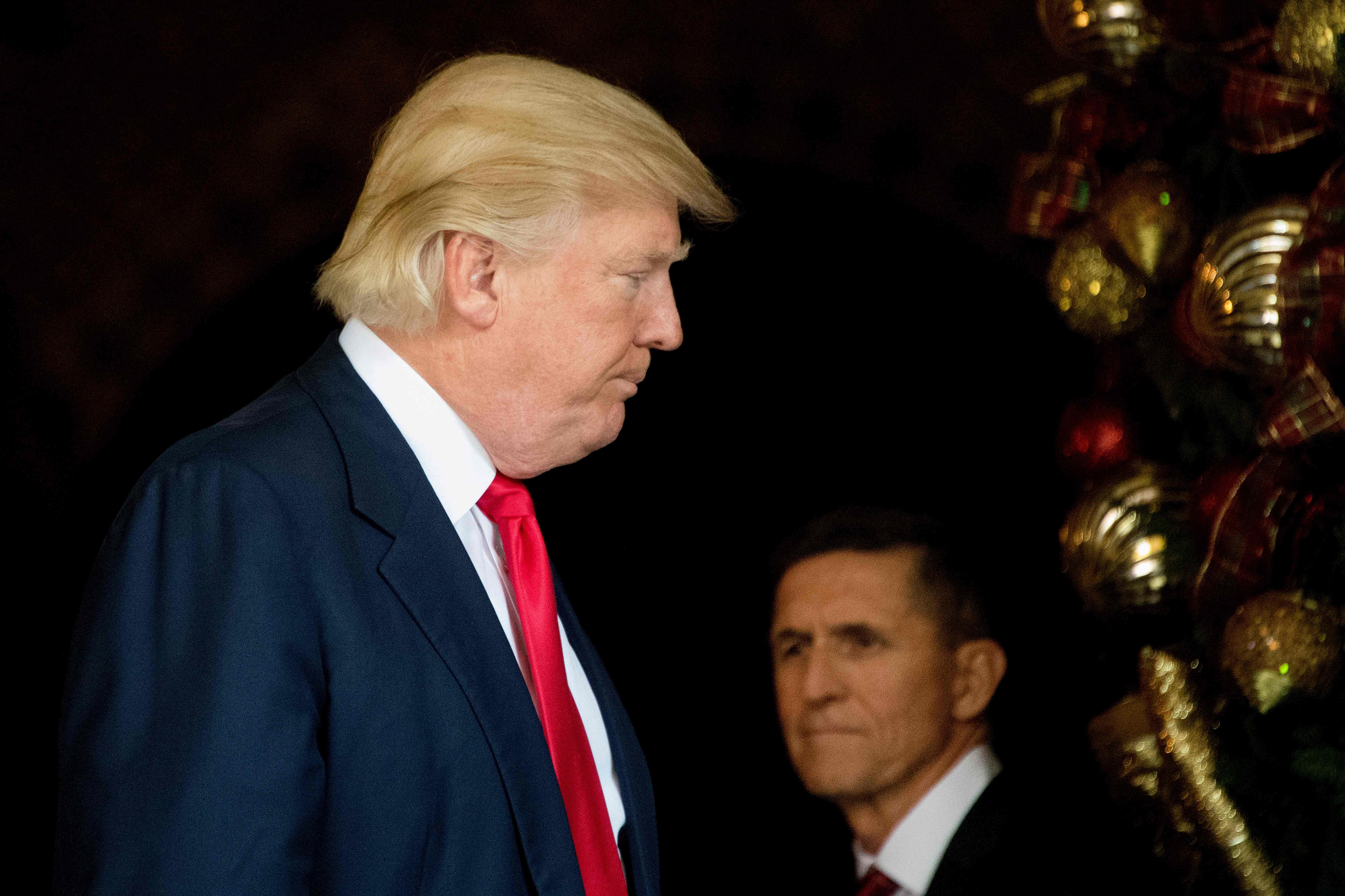 Donald Trump (L) stands with Michael Flynn at Mar-a-Lago. Photo: AFP