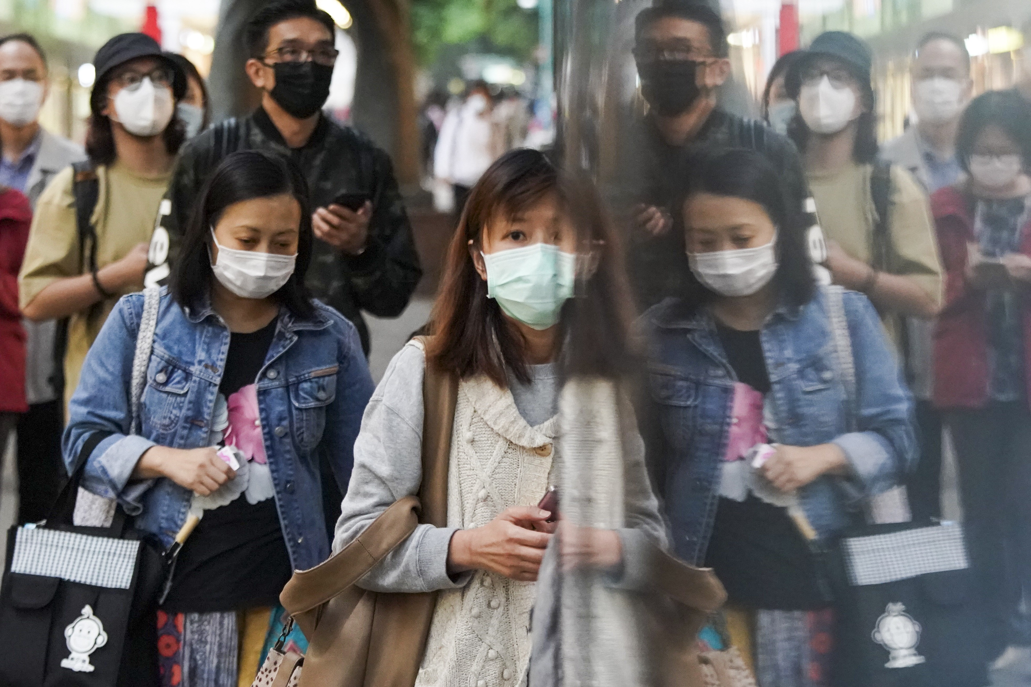 Pedestrians in Tsim Sha Tsui, Hong Kong, following the outbreak of the new coronavirus. Photo: Felix Wong