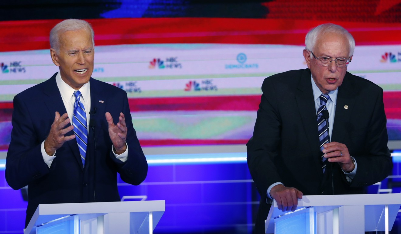 Democratic presidential candidates Joe Biden (left) and Bernie Sanders speak during the Democratic primary debate in Miami in June. Photo: AP