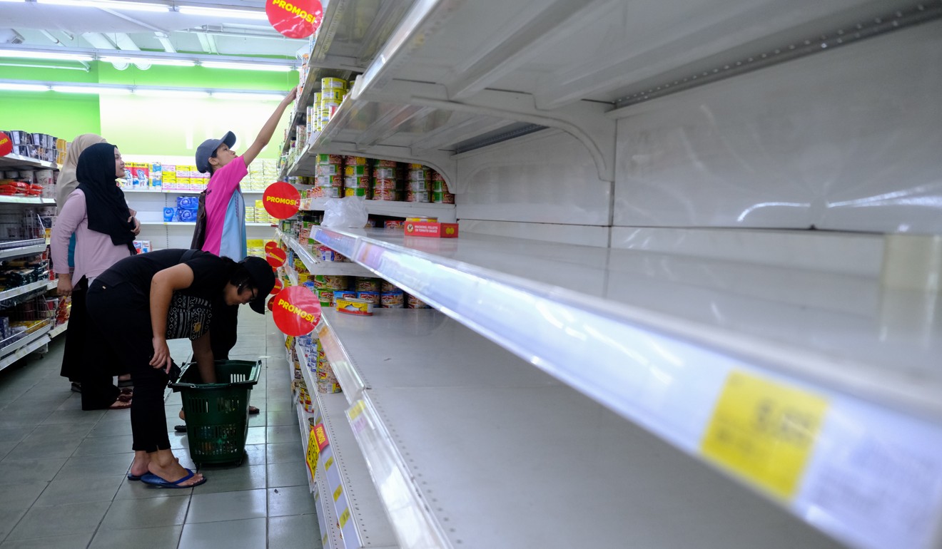Panic buying has emptied supermarket shelves. Photo: Bloomberg