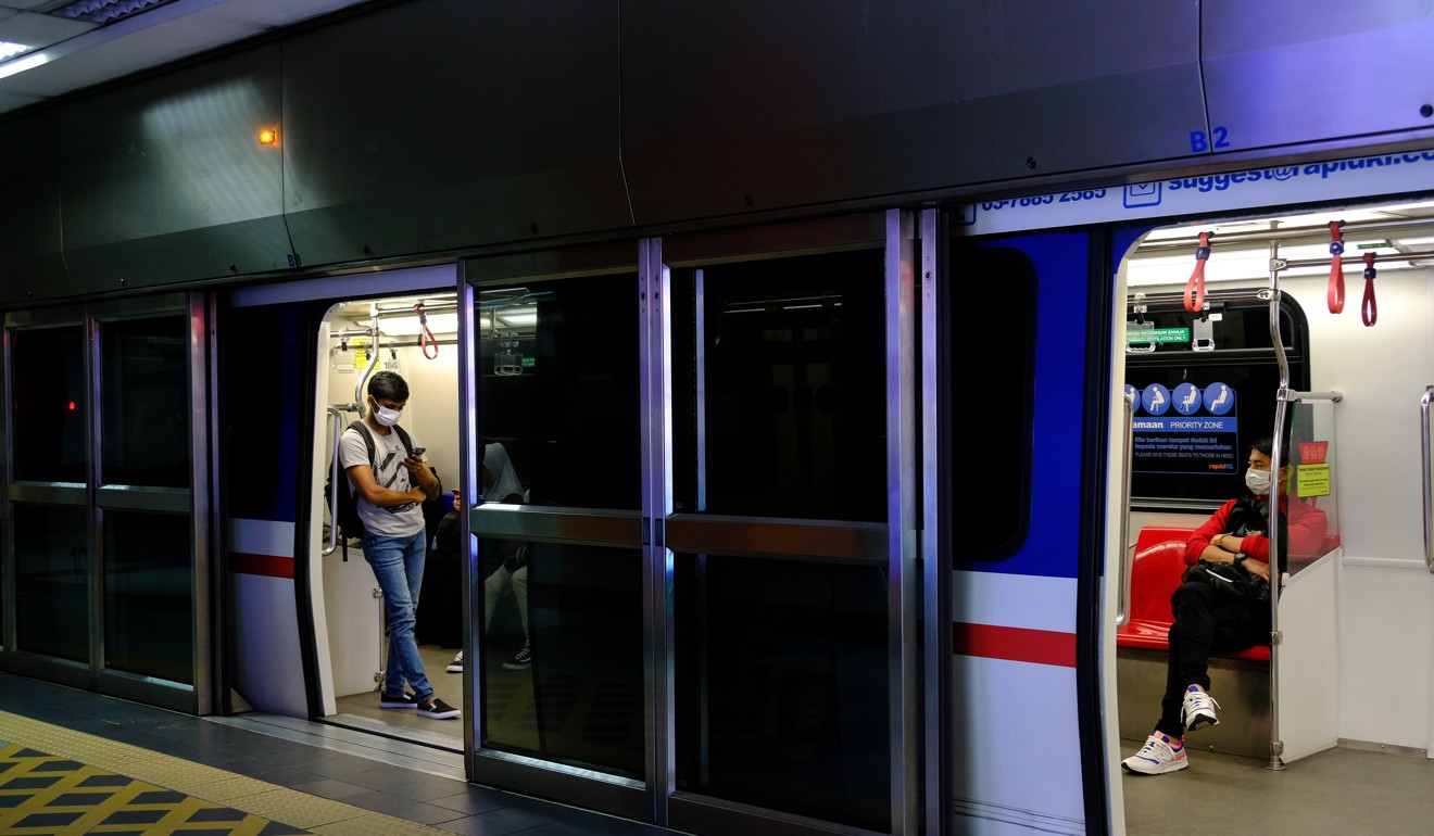 Commuters aboard a Mass Rapid Transit train in Kuala Lumpur. Photo: Bloomberg