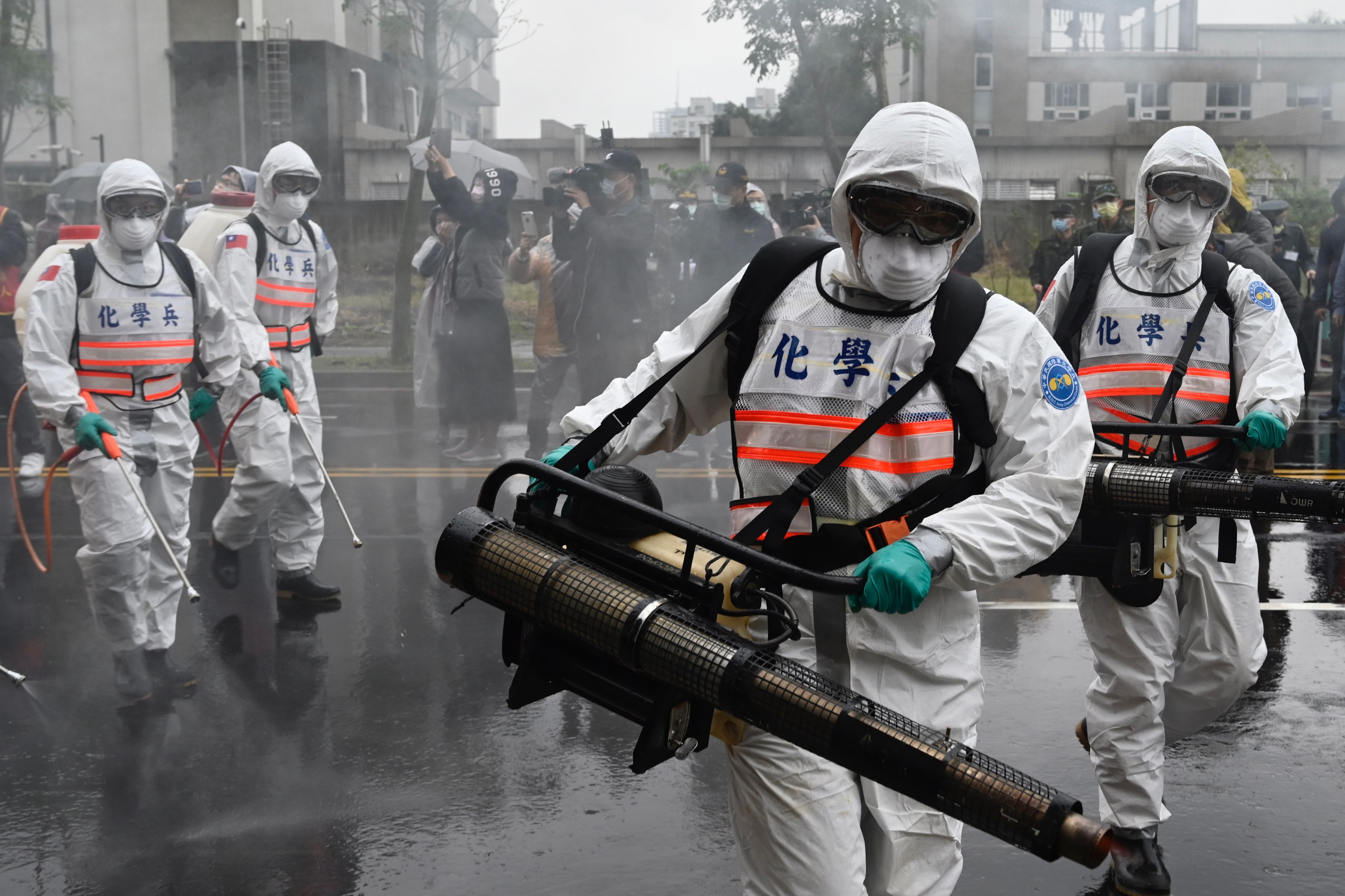 Soldiers practice using disinfectant guns in Taiwan’s Xindian district last week. Photo: AFP