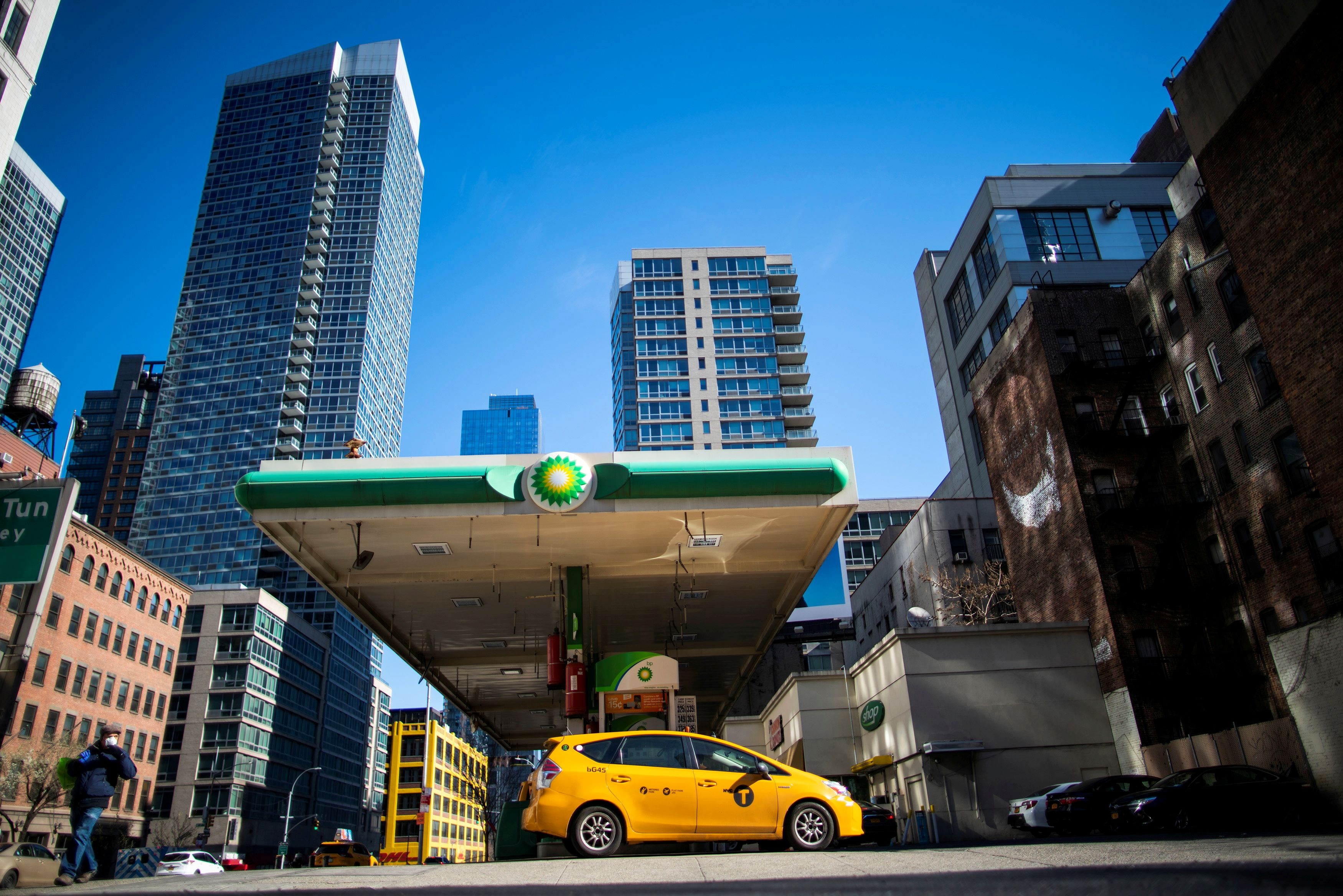 A taxis fills up at a petrol station in New York. Oil prices have been falling as global demand has been slumping because of the coronavirus pandemic. Photo: Reuters