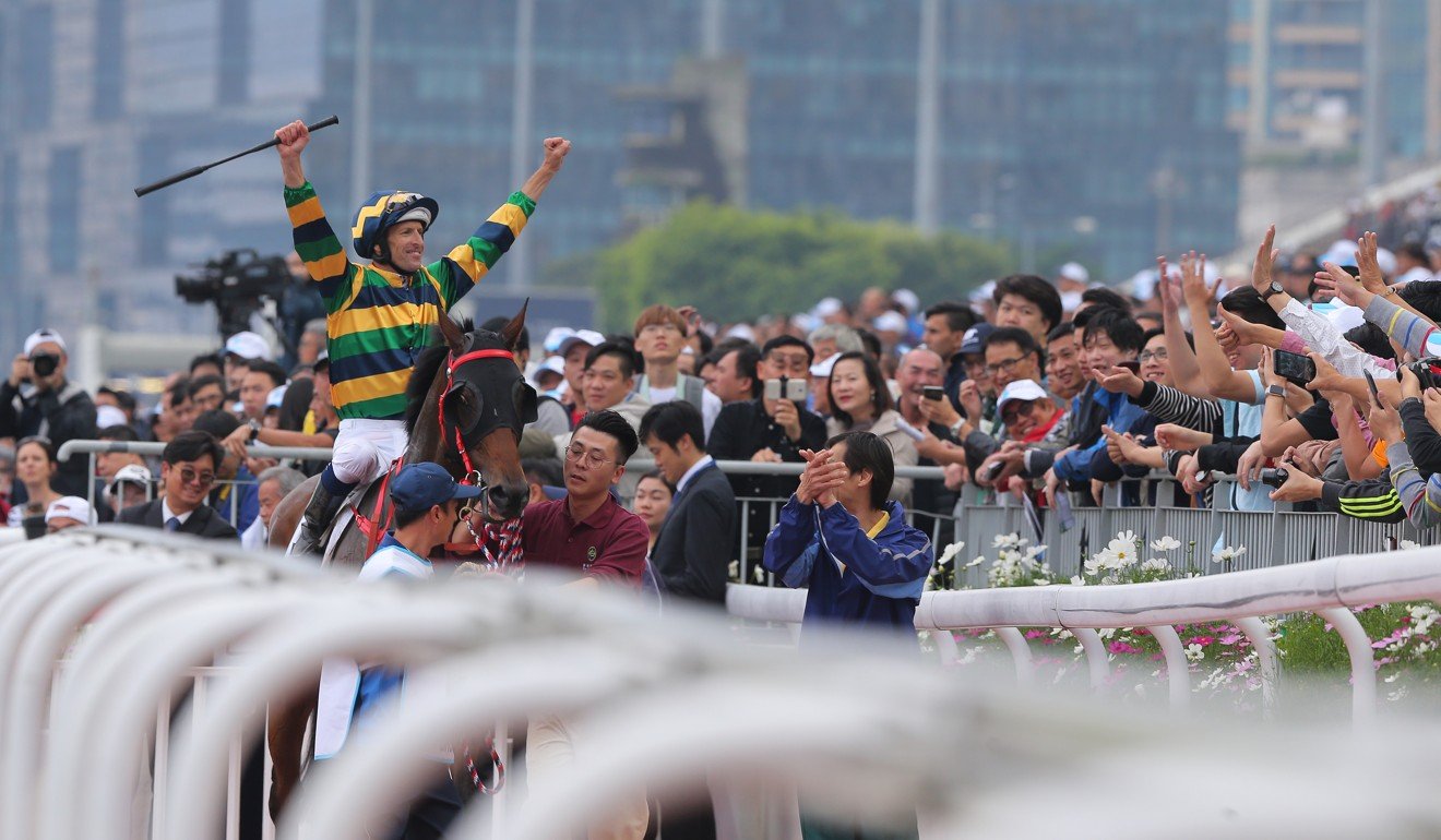 Hugh Bowman celebrates with the fans after winning the Derby with Furore.