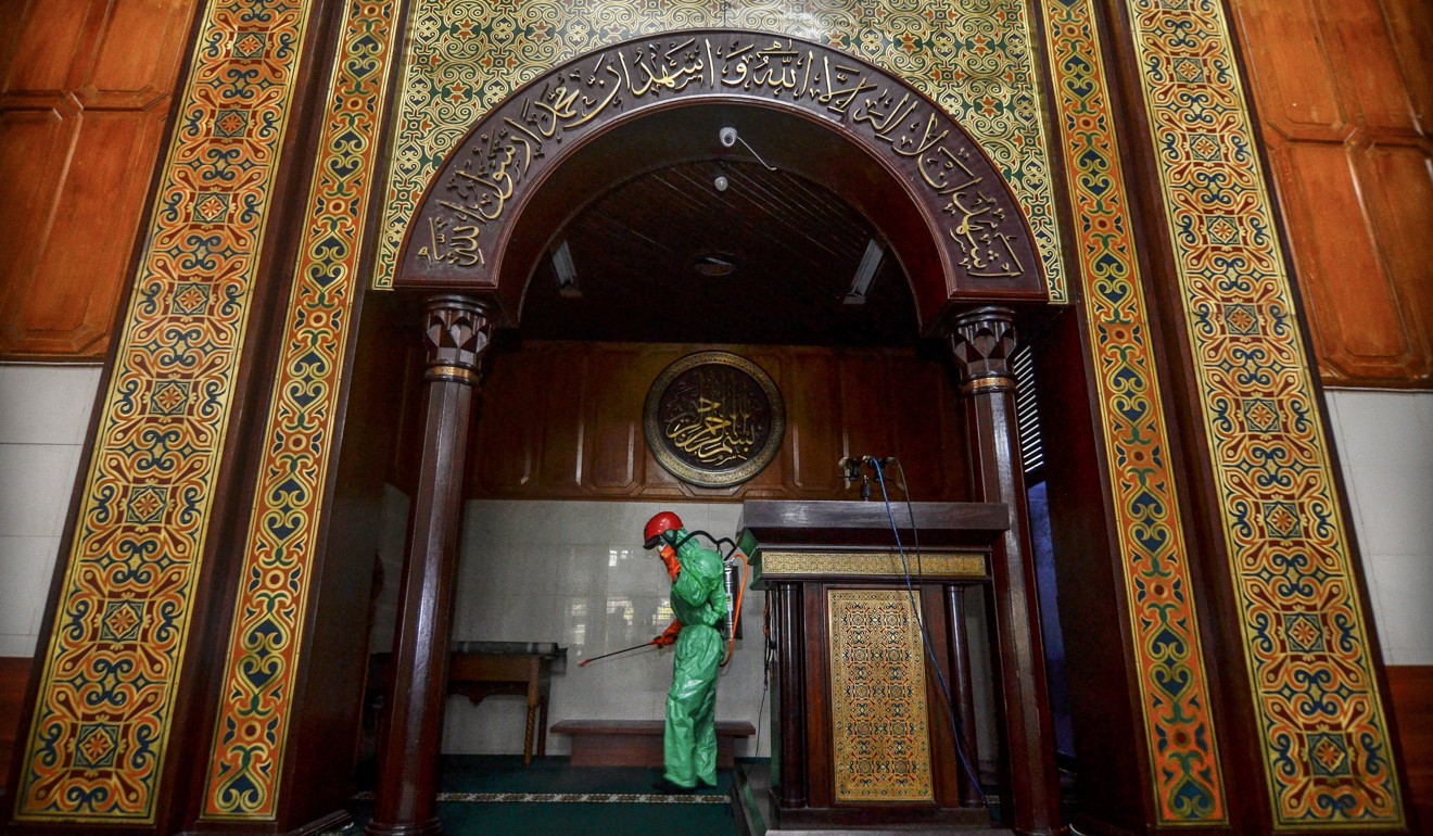 A mosque in Indonesia is disinfected to guard against the coronavirus. Photo: Reuters