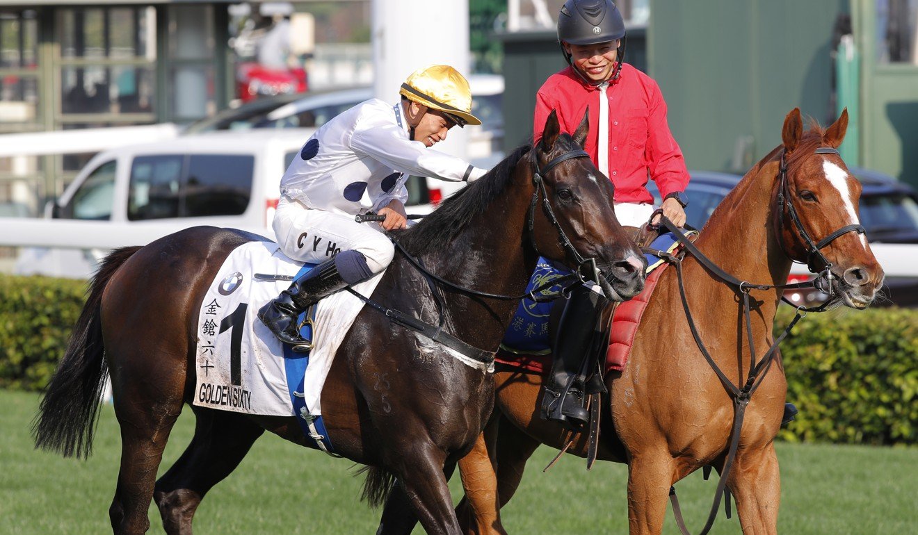 Vincent Ho pats Golden Sixty after winning the Hong Kong Derby on Sunday.