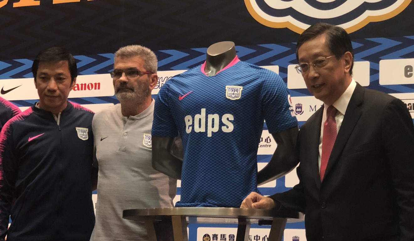Kitchee president Ken Ng Kin (right) unveils the club's new jersey with coach Blaz Sliskovic and Alex Chu Chi-kwong. Photo: Chan Kin-wa