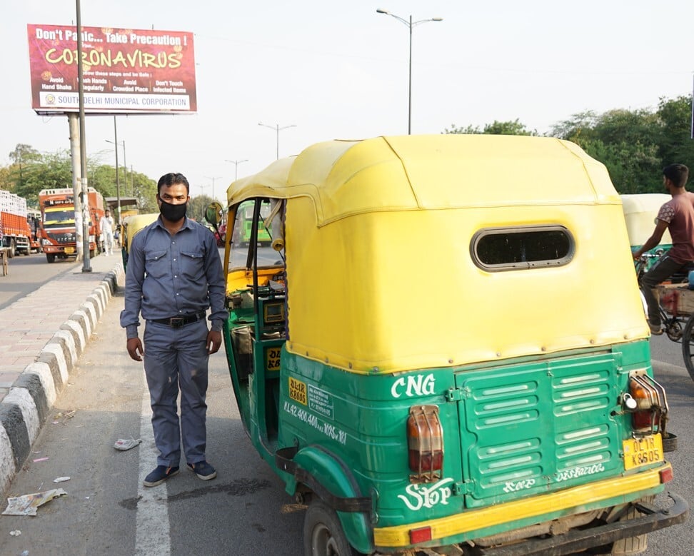 Autorickshaw driver Pappu Yadav worked 18 hours on Saturday before India’s lockdowns took effect. Photo: Adnan Bhat