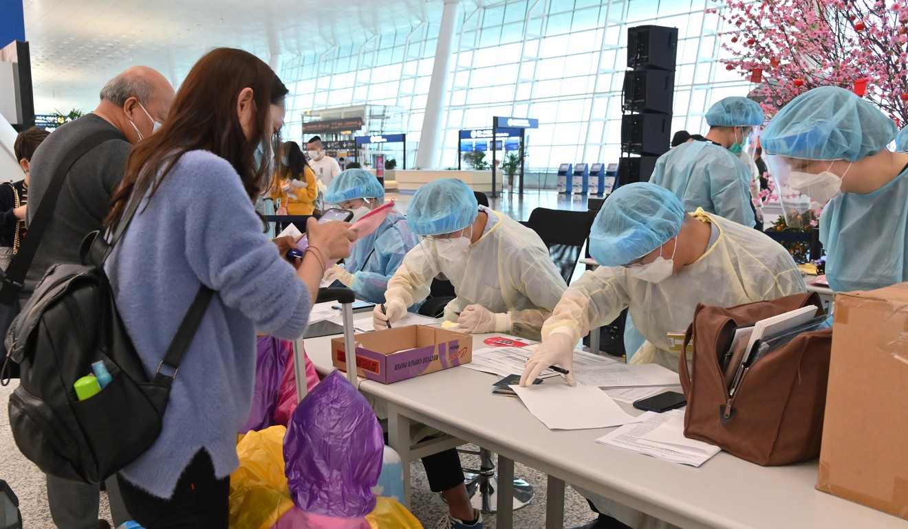 A family registers with immigration authorities at Wuhan Tianhe International Airport before finally returning to Hong Kong. Photo: Handout