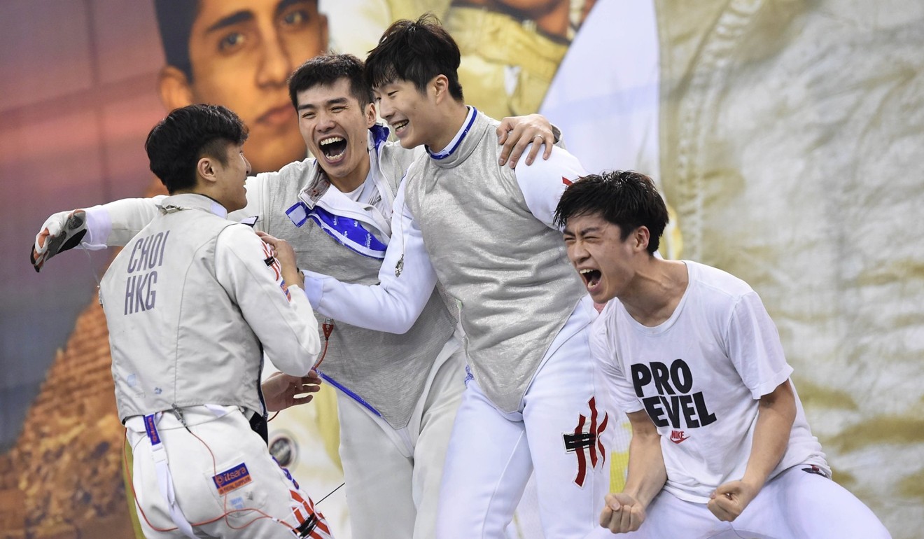 Hong Kong men’s foil team celebrate after qualifying for the 2020 Olympics at the World Cup series in Cairo. From left: Ryan Choi, Cheung Siu-lun, Cheung Ka-long and Lawrence Ng.