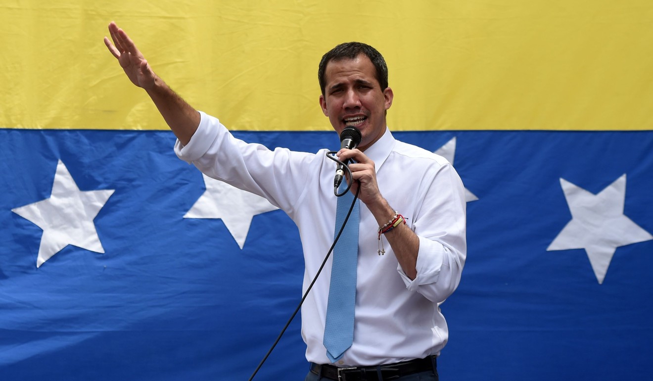 Venezuelan opposition leader Juan Guaido addresses supporters during a street meeting within a demonstration heading to the National Assembly in Caracas on March 10. Photo: AFP