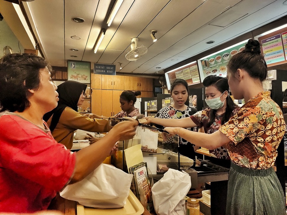 Staff and customers at Jamu Bukti Mentjos. Photo: Sylviana Hamdani