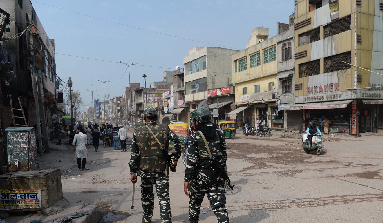 Security personnel patrol a road in New Delhi on March 1 following sectarian riots over India’s new citizenship law. Photo: AFP