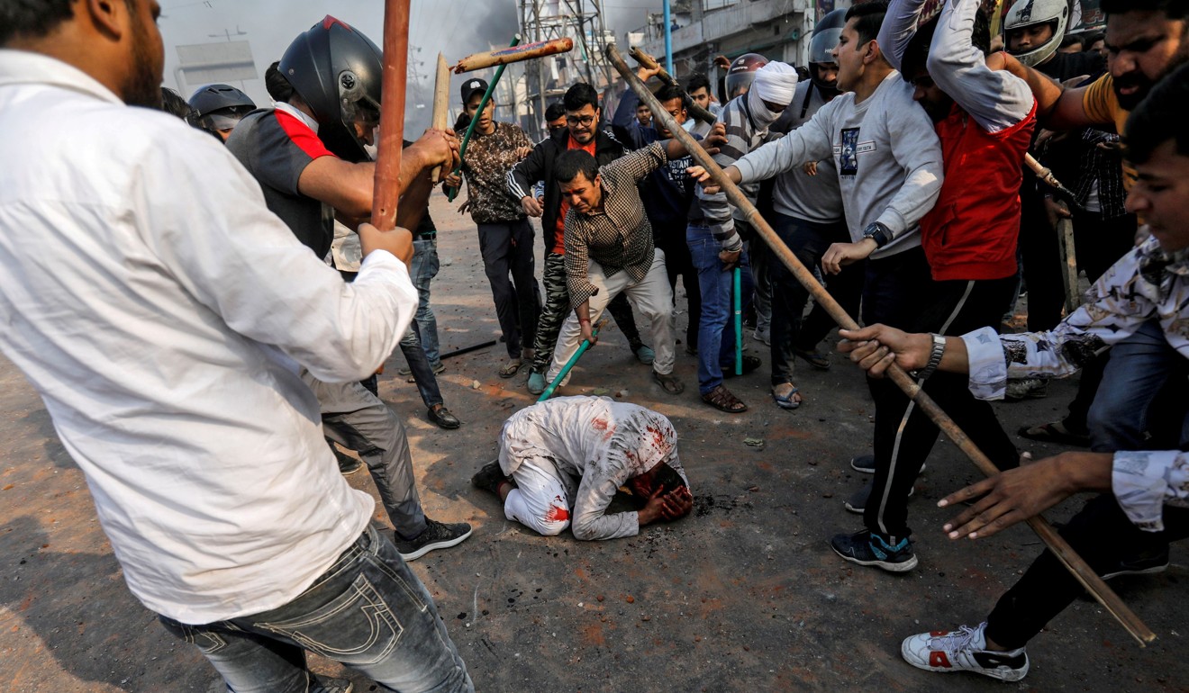 A group of men in New Delhi chanting pro-Hindu slogans beat Mohammad Zubair, 37, who is Muslim, during protests sparked by a new citizenship law in New Delhi. Photo: Reuters