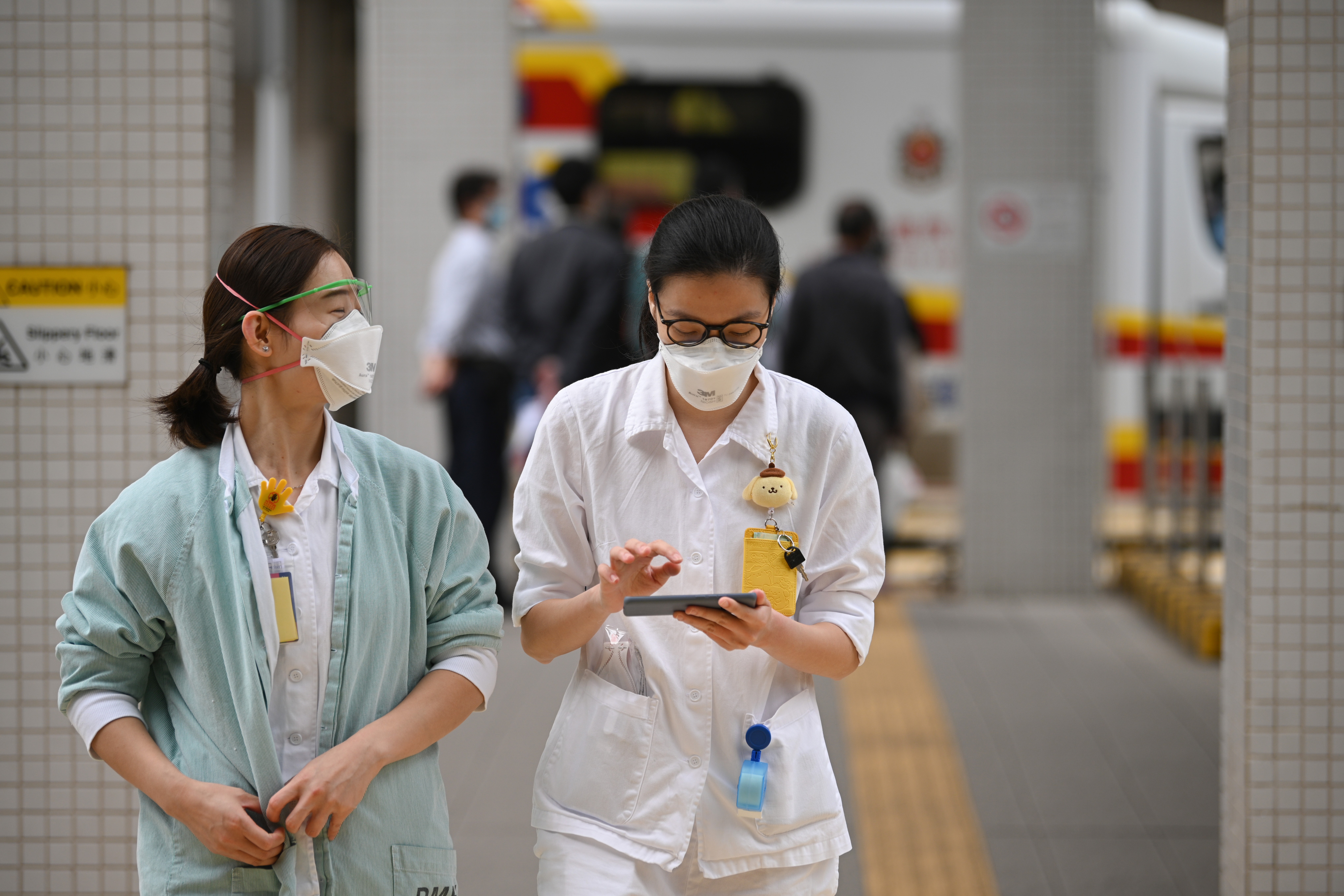 Medical staff are seen outside Princess Margaret Hospital in Hong Kong. Photo: AFP