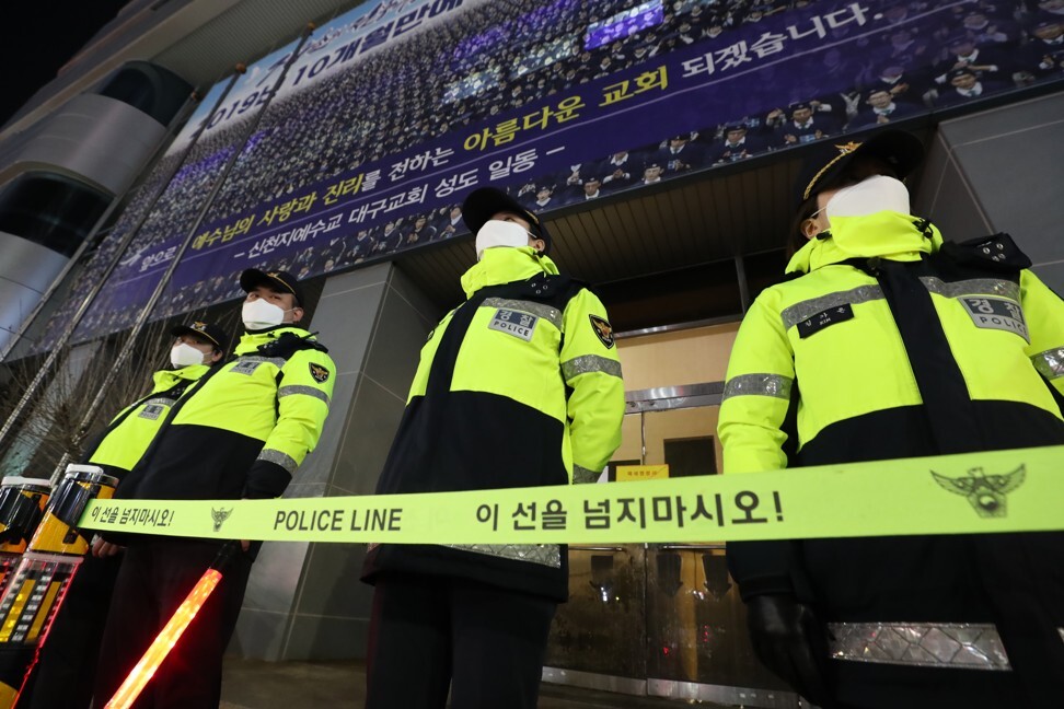 South Korean police officers in front of the Shincheonji Church of Jesus in Daegu, which was the centre of the country's single largest infection cluster. Photo: EPA-EFE