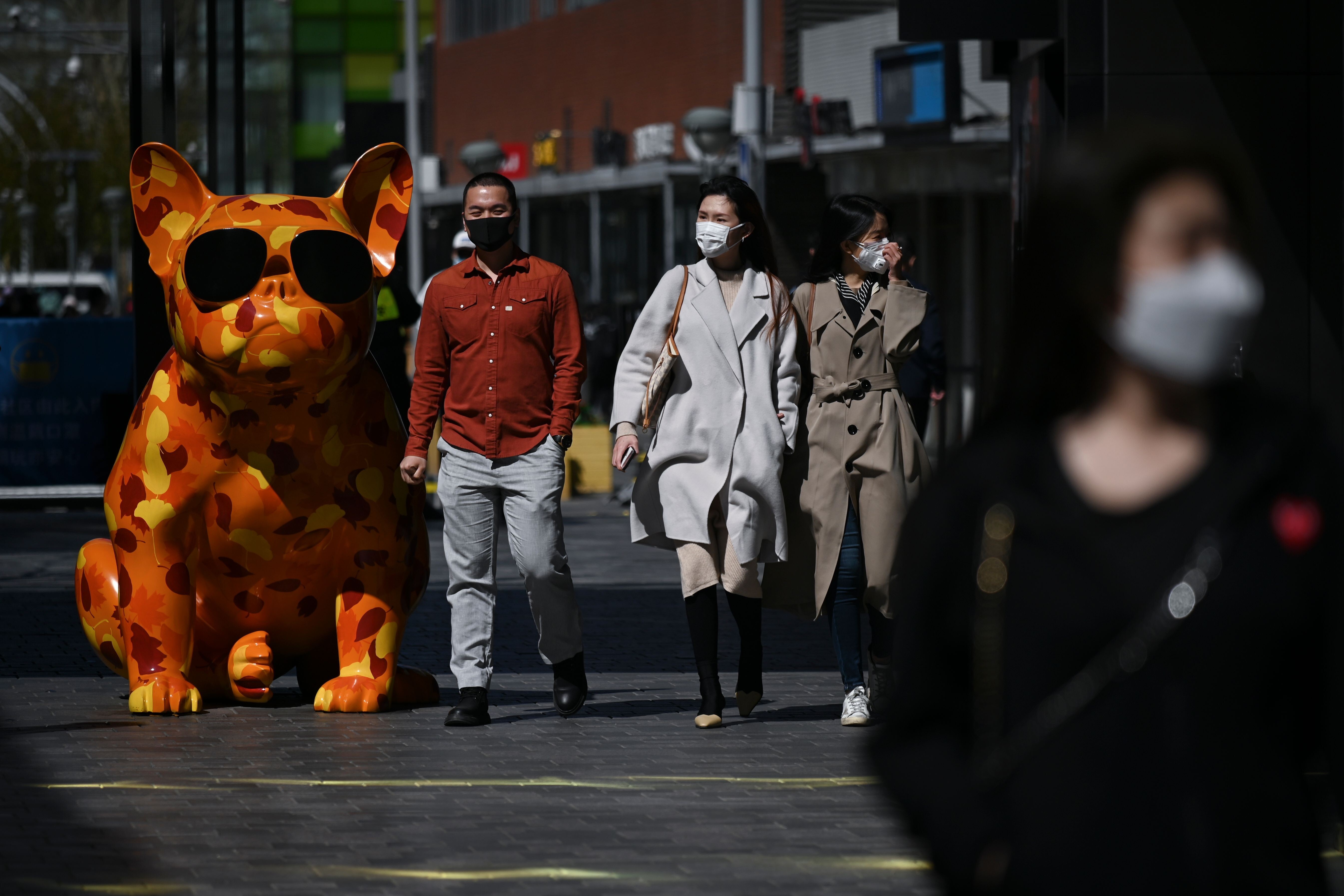 Pedestrians in Beijing. Photo: AFP