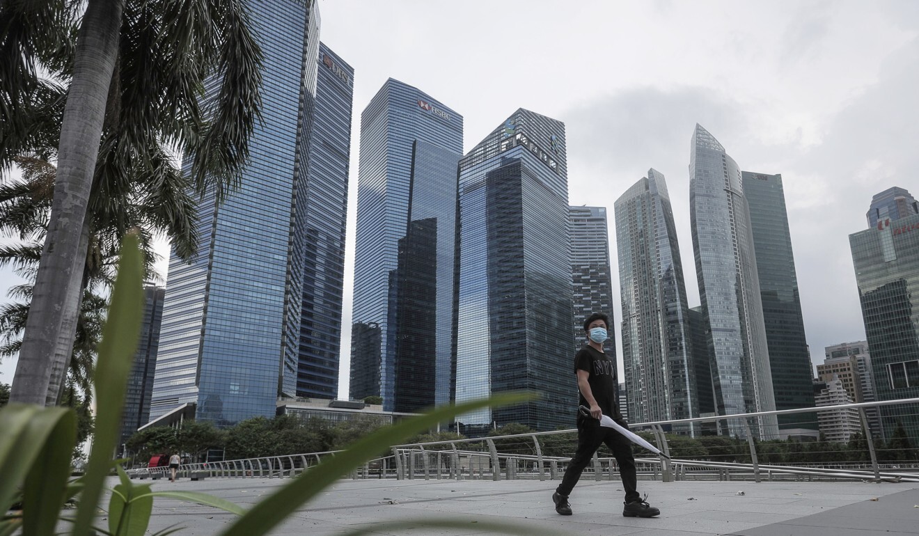 A man walks past the financial district in Singapore. Photo: EPA-EFE