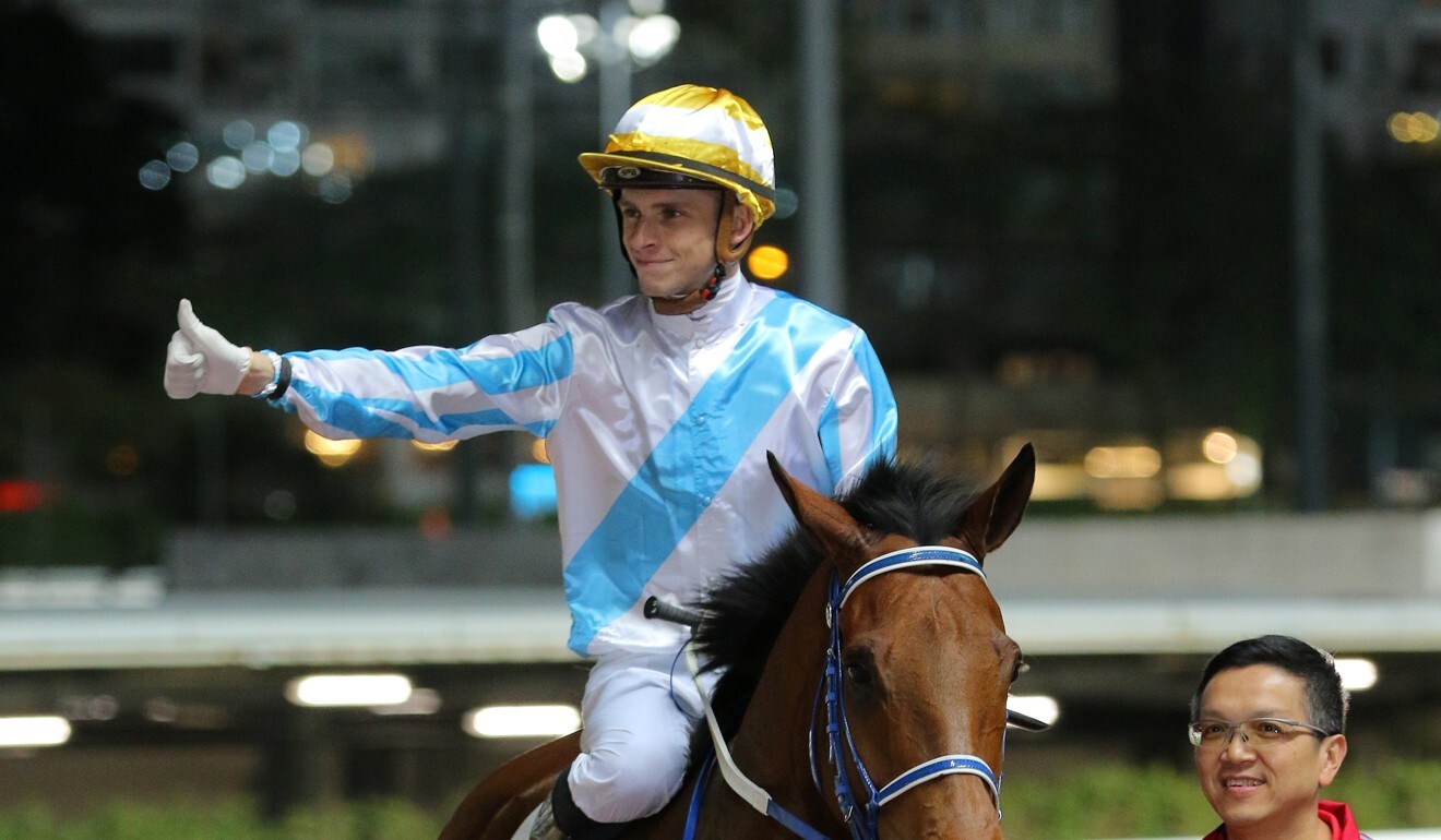 Lyle Hewitson heads for the winner’s circle after saluting on Methane at Happy Valley.