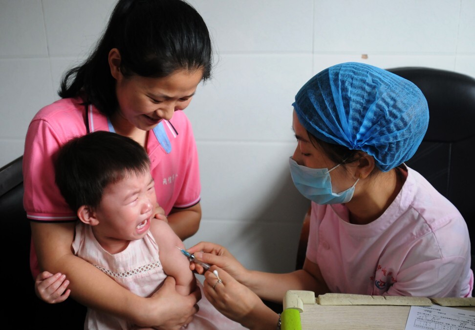 A child receives a vaccination shot at the local disease control and prevention centre in Jiujiang, China. Photo: AFP