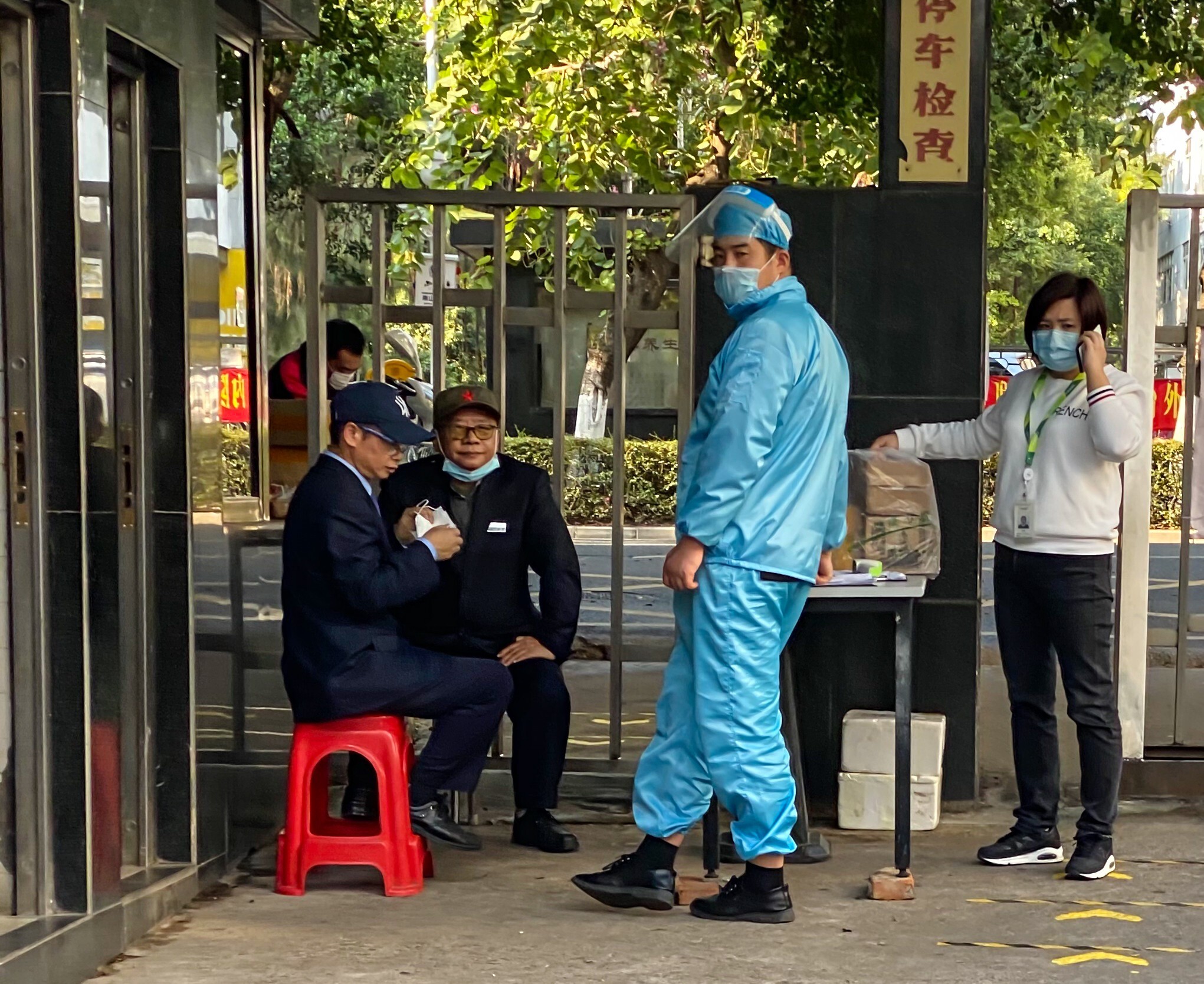 A security guard in protective gear in Shenzhen. Photo: Veronica Lin