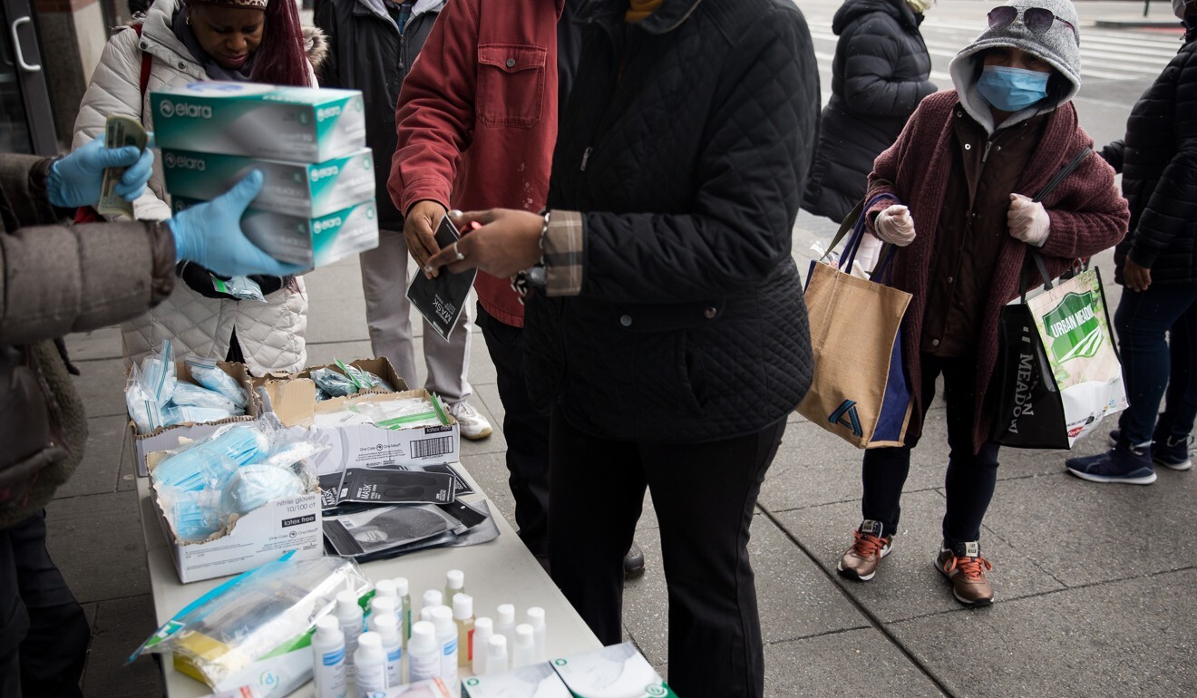 A vendor hawks face masks and other hygiene products in New York. Photo: Xinhua