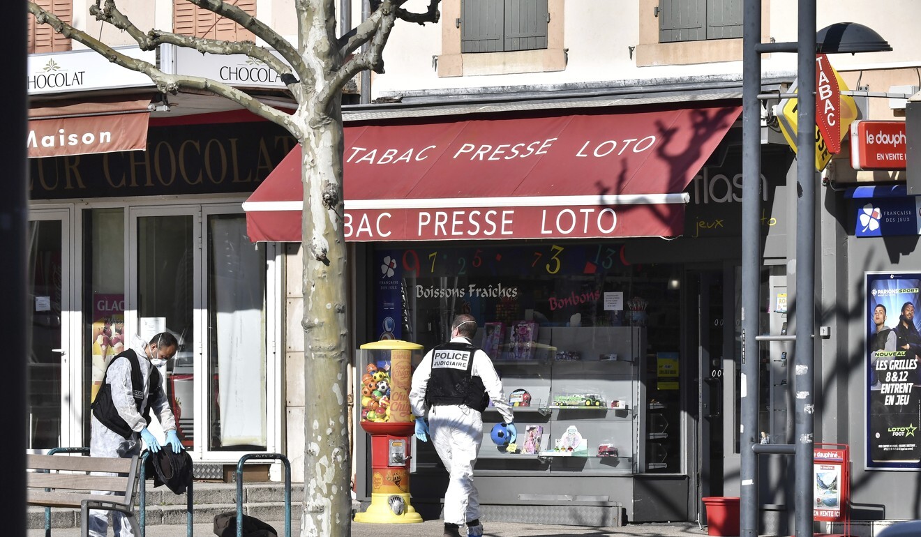 Police officers investigate after a man wielding a knife attacked residents. Photo: AP Photo