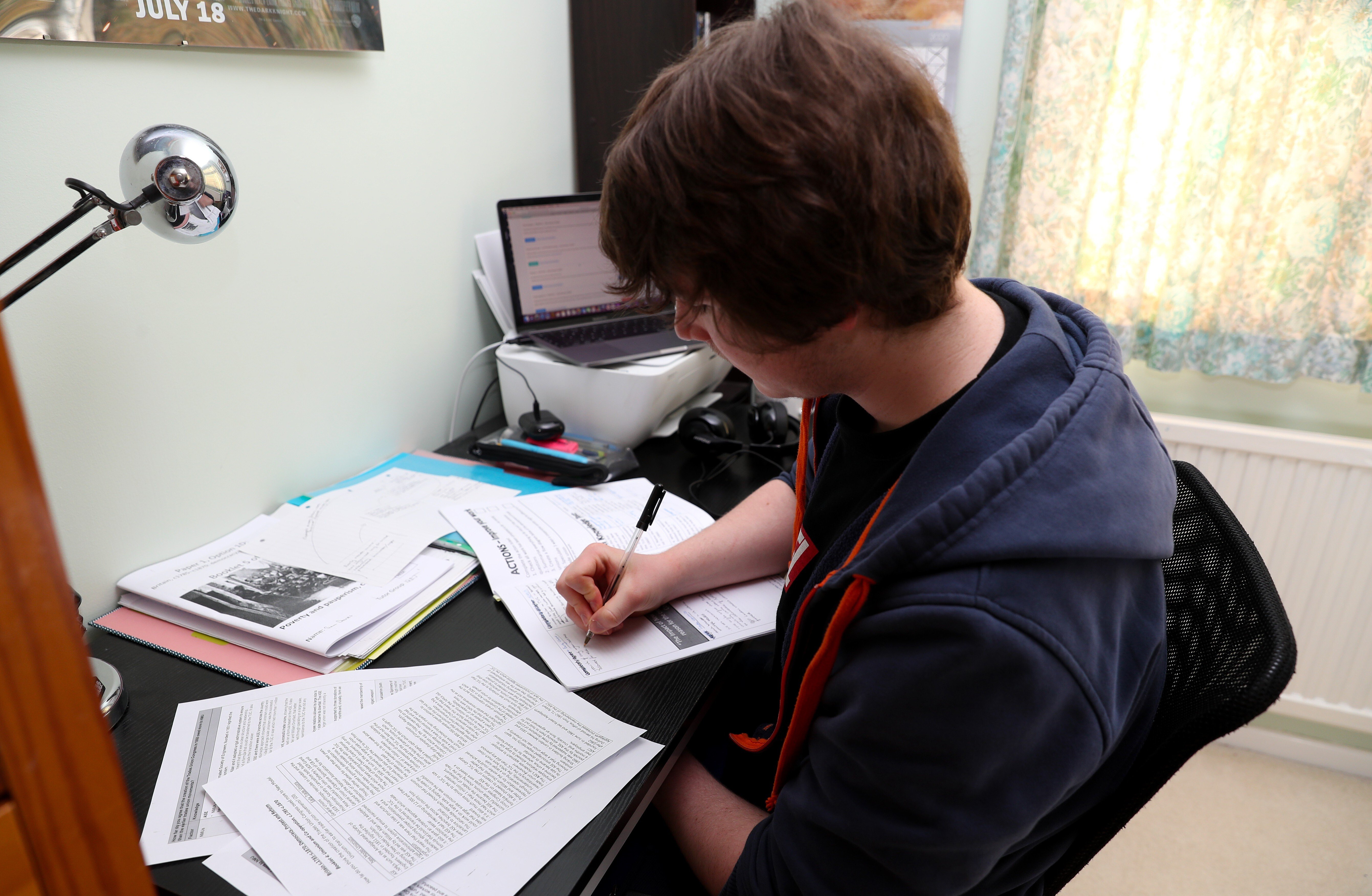 A student doing his school work from home after British Prime Minister Boris Johnson put the country in lockdown. Photo: PA Images via Getty Images