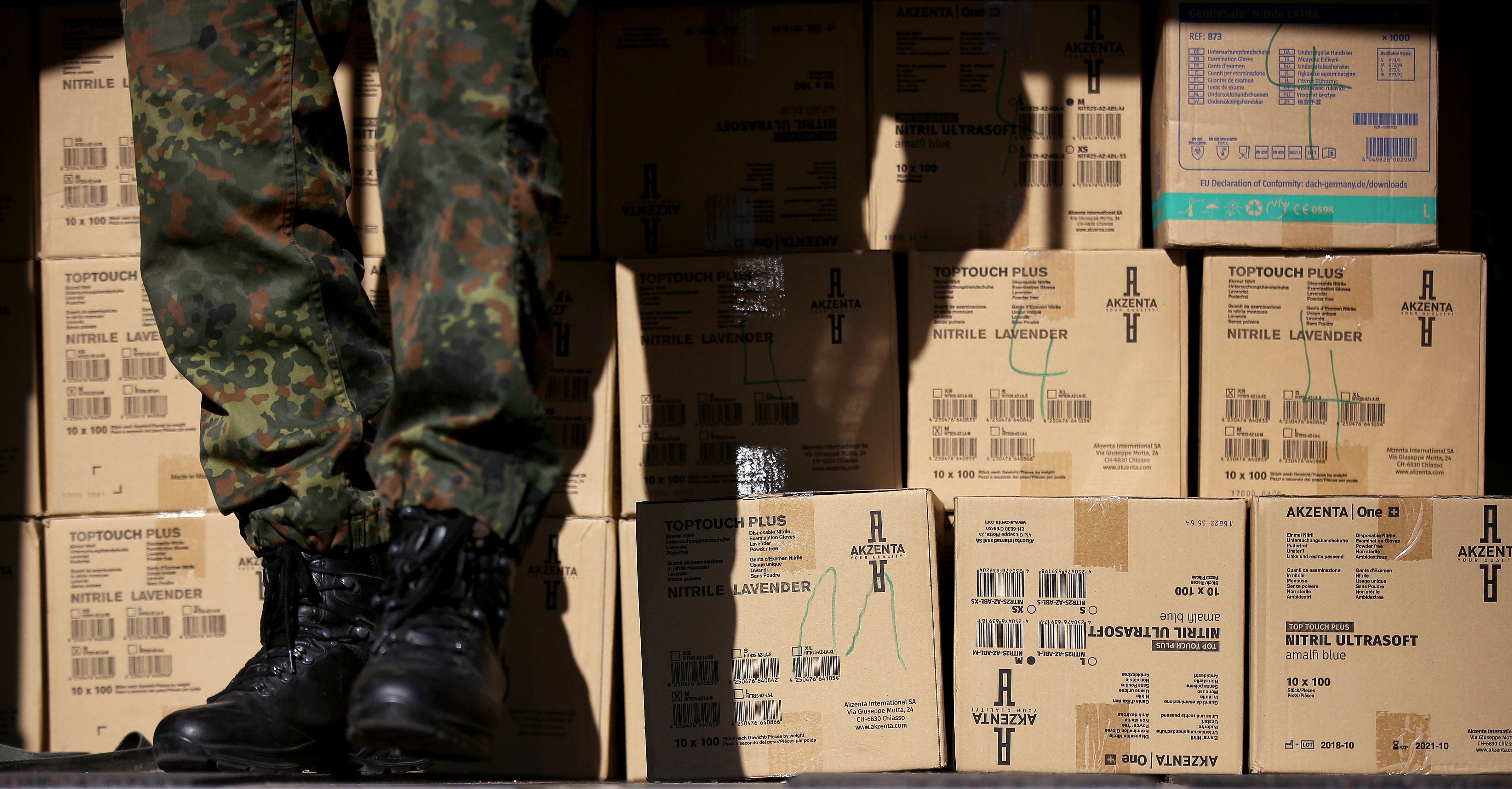 Soldiers from the German army's logistics battalion load protective medical equipment into an army vehicle in Magdeburg, eastern Germany. File photo: AFP
