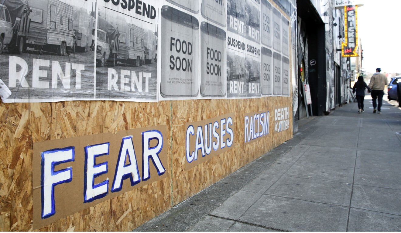 A signs that reads ‘fear causes racism’ is pictured on a boarded-up business in Seattle's Capitol Hill neighbourhood on march 29. Photo: Reuters