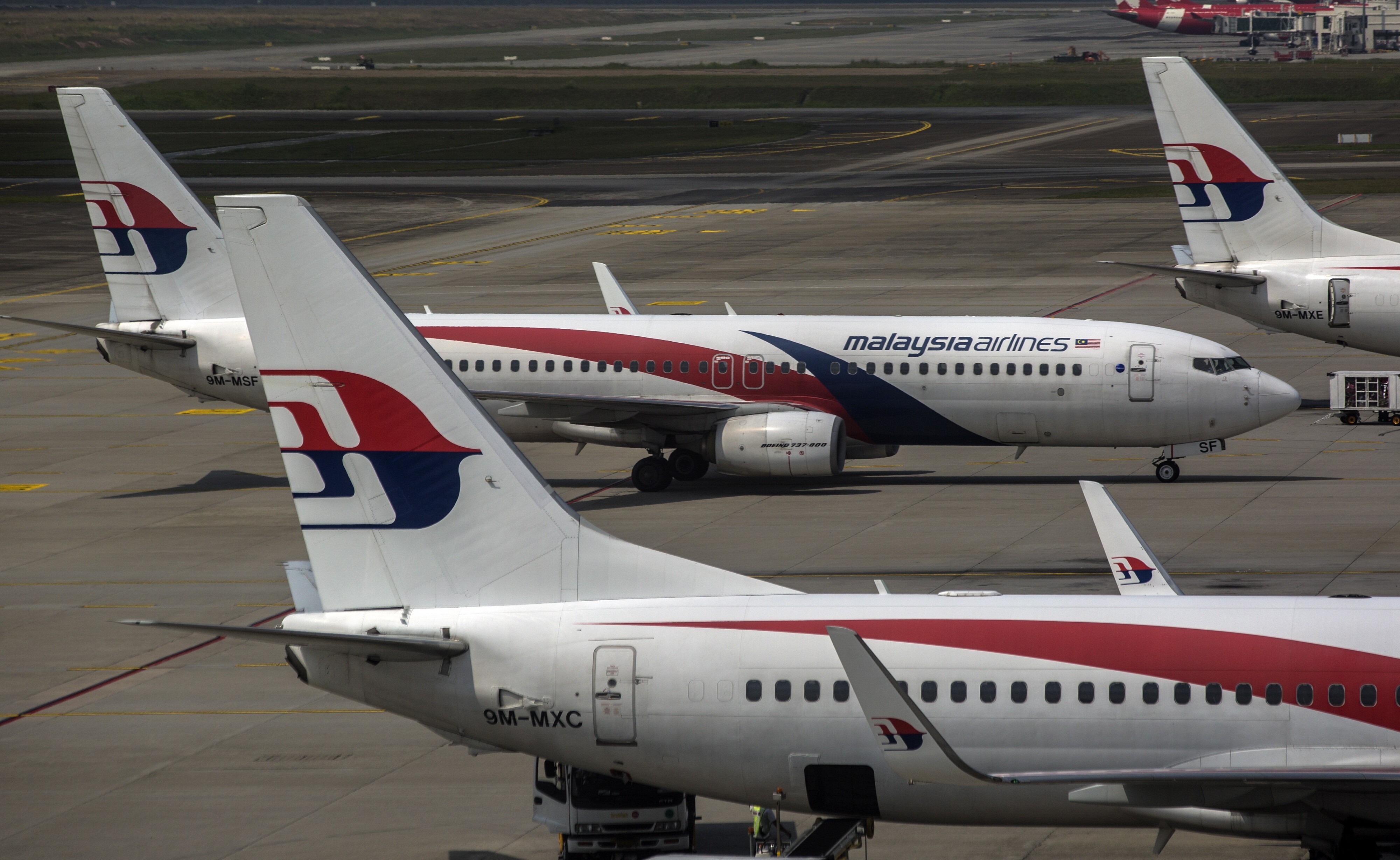 Malaysia Airlines aircraft are seen from the viewing gallery at the Kuala Lumpur International Airport. Photo: EPA-EFE