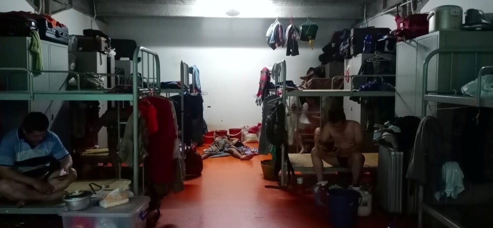 Workers in a dormitory where a quarantine is in effect. Photo: Obtained by Reuters