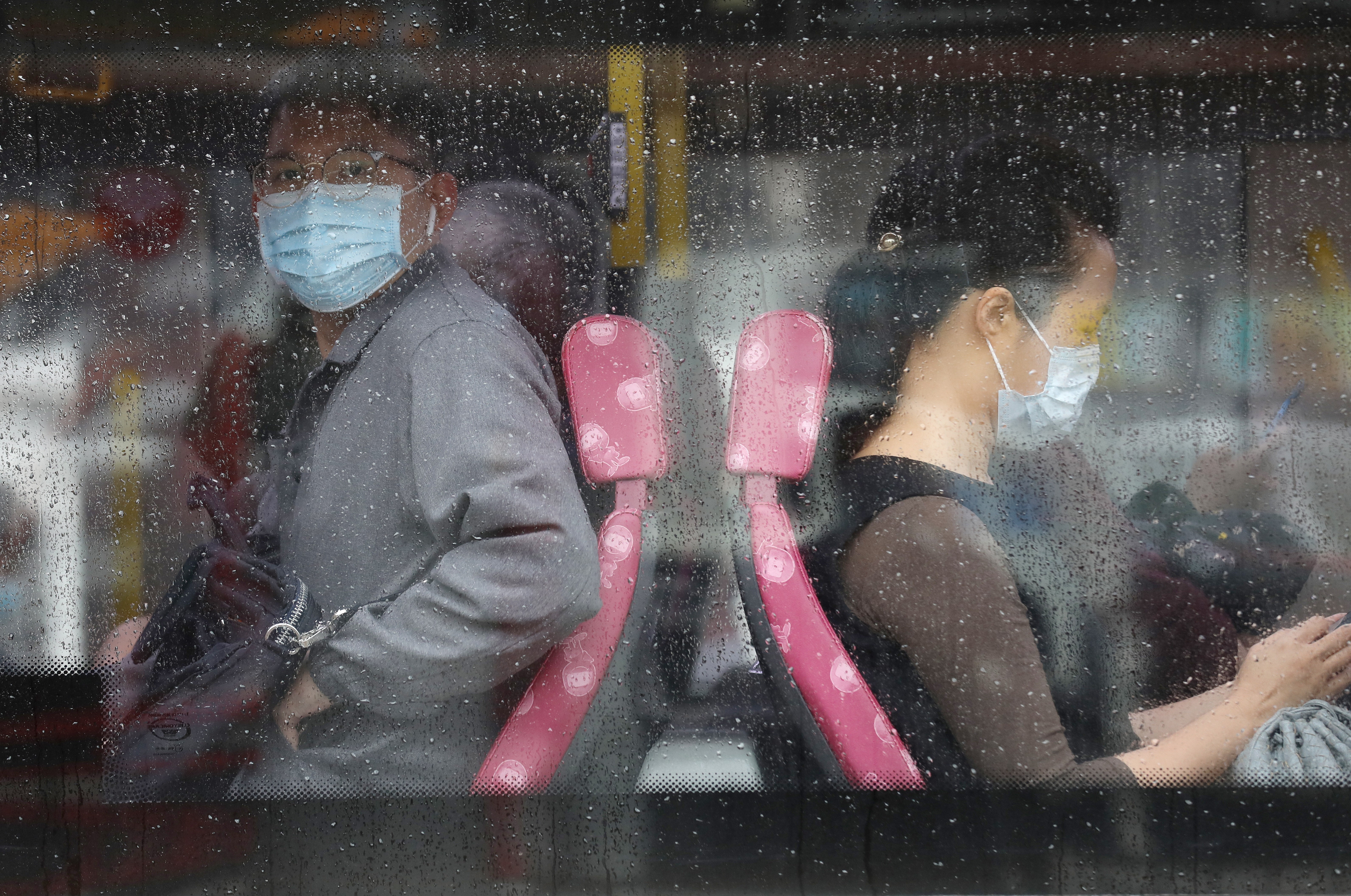 Commuters in face masks in Hong Kong. Photo: Winson Wong