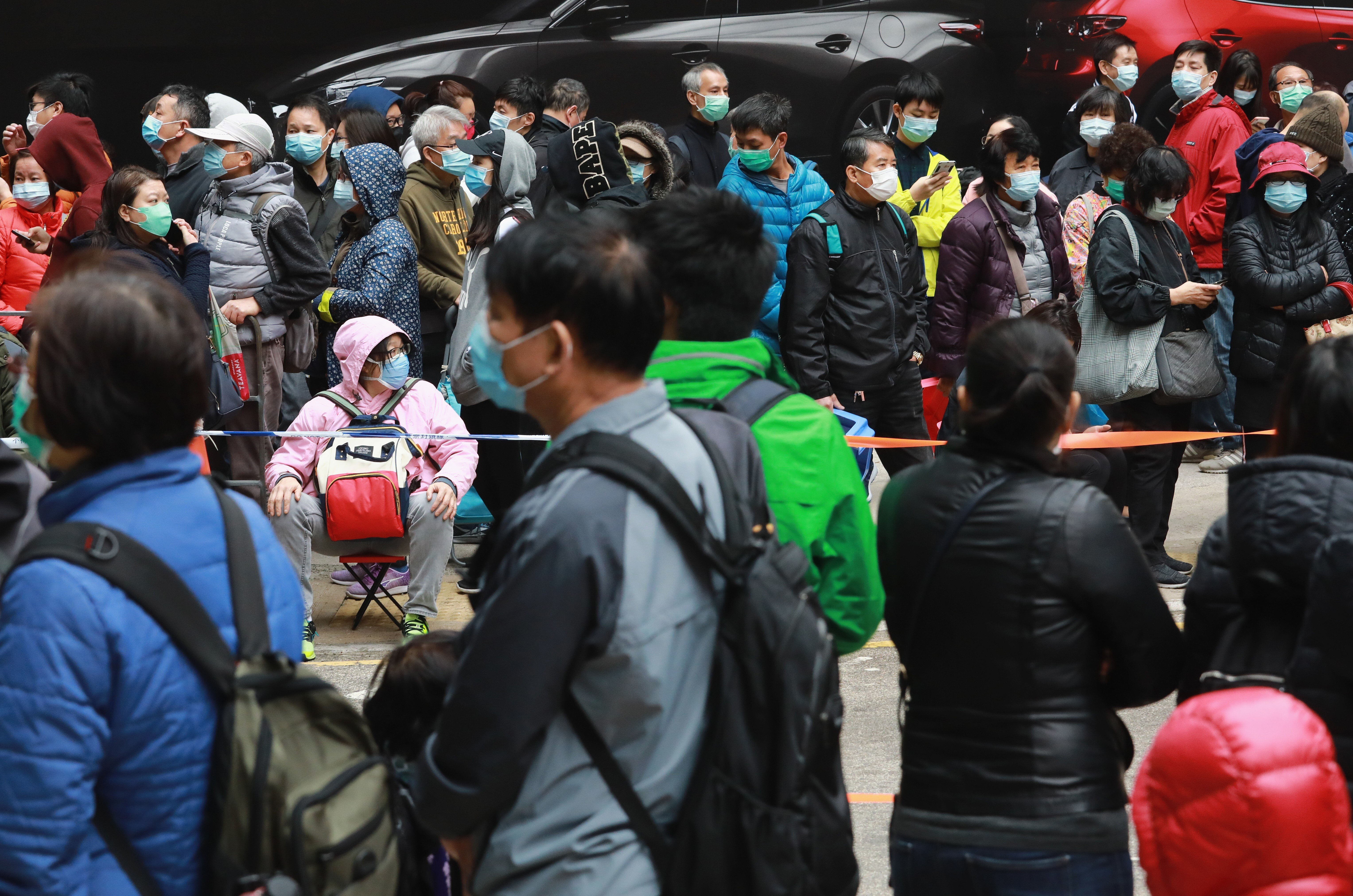People queue to buy face masks in Kowloon Bay in early February 2020. Photo: May Tse