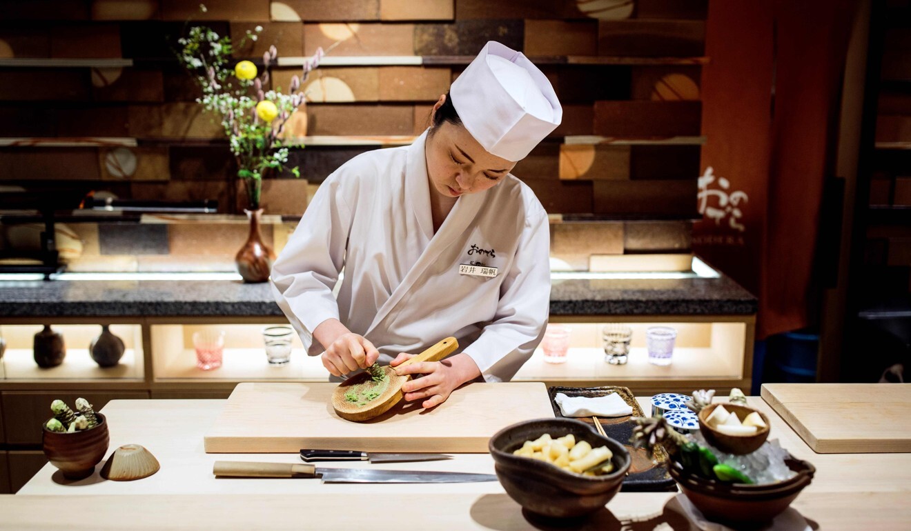 Mizuho Iwai grinds wasabi at Sushi Ginza Onodera restaurant in Tokyo. Photo: AFP