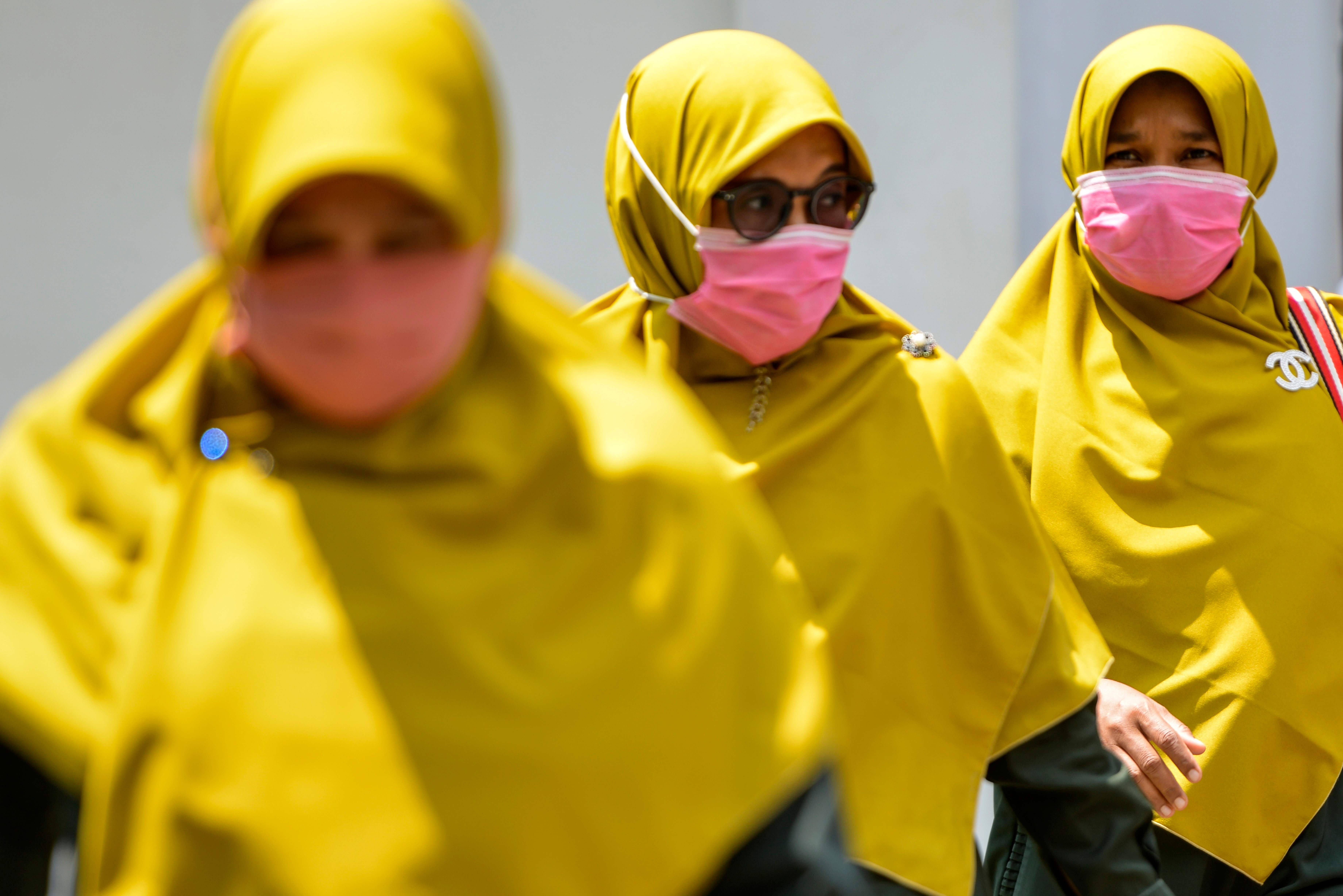 Women in Banda Aceh, Indonesia, wear face masks to guard against the coronavirus. Photo: AFP